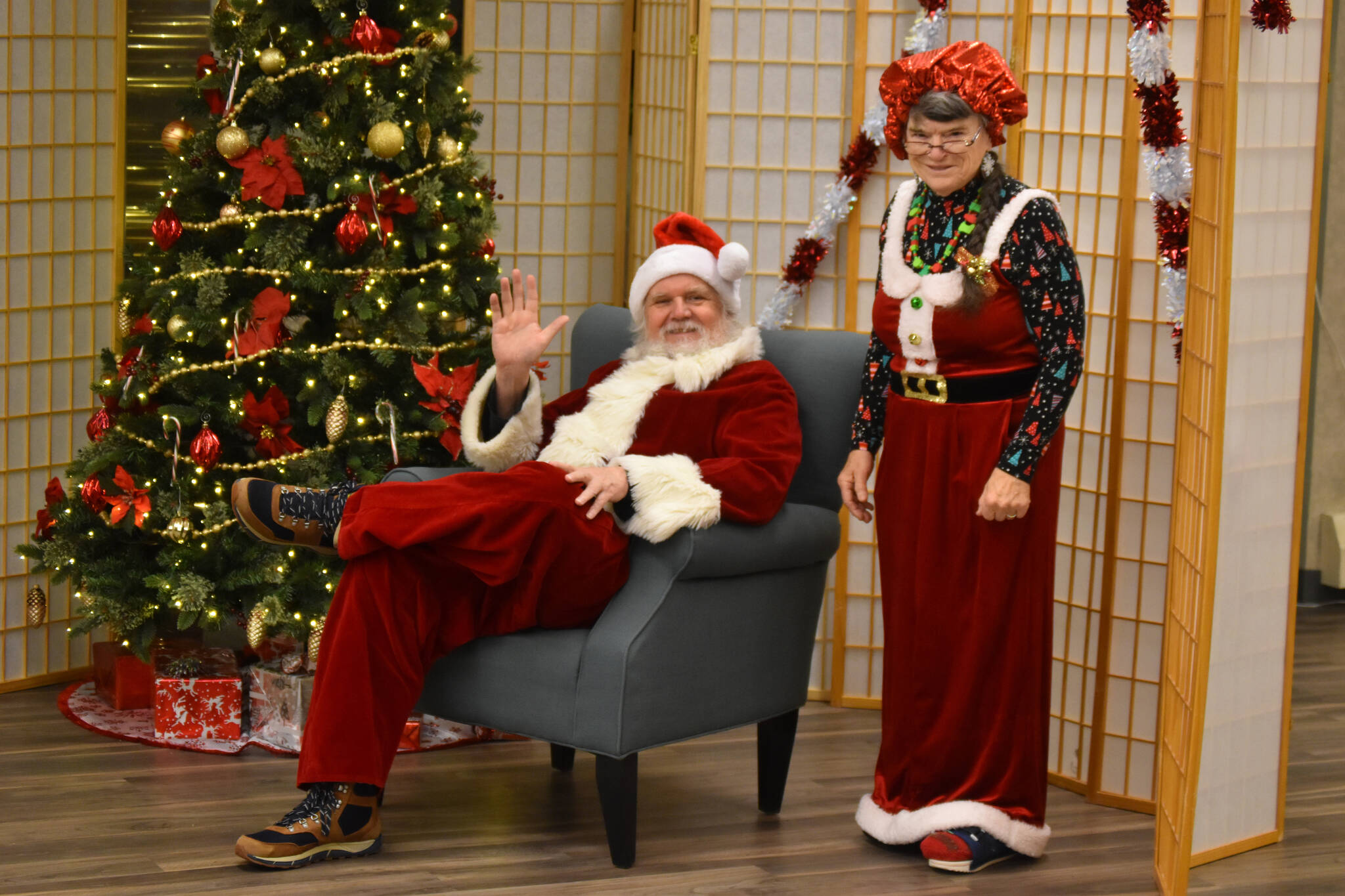 Santa, played by Ken Aaron, and Mrs. Claus, played by Kit Hill, wait for children to arrive during Breakfast with Santa at the Kenai Senior Center in Kenai, Alaska, on Monday, Dec. 19, 2022. (Jake Dye/Peninsula Clarion)