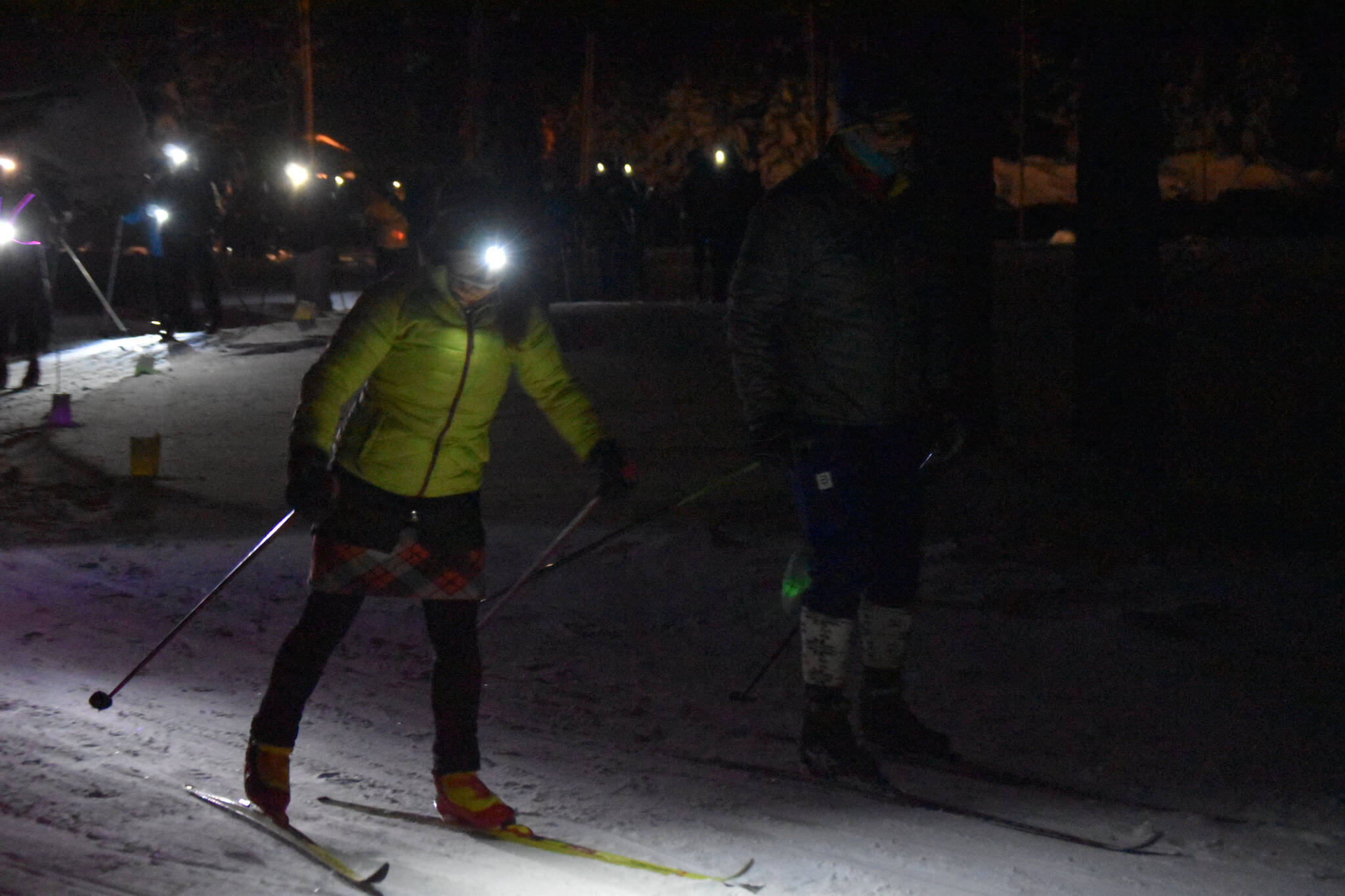 Skiiers take off down the trail during StarLight StarBright: A Winter Solstice Ski Event on Wednesday, Dec. 21, 2022 at the Kenai Golf Course in Kenai, Alaska.