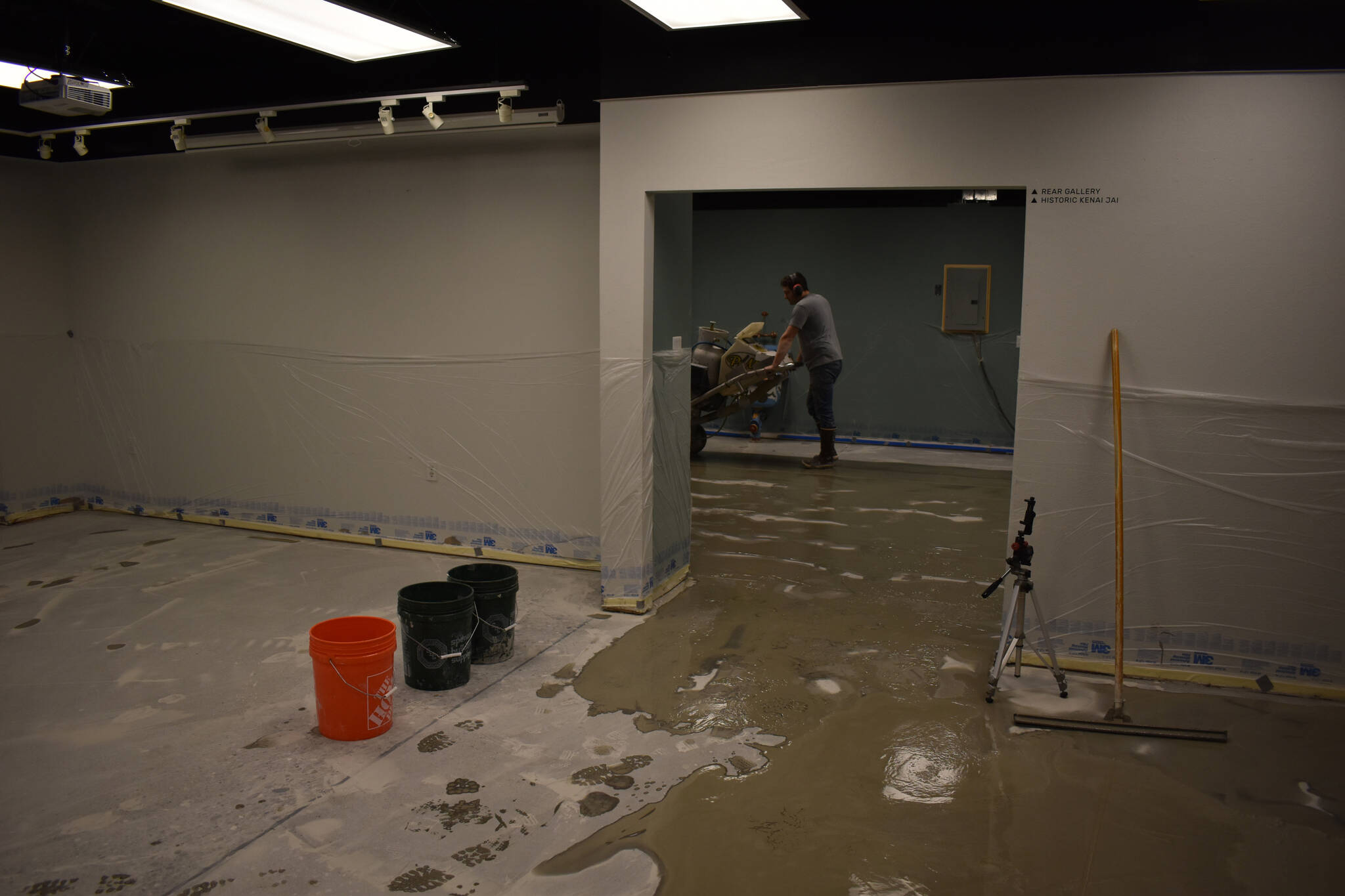 Jon Boehmler grinds the floors at the Kenai Art Center in Kenai, Alaska, as part of a flooring renovation on Wednesday, Dec. 28, 2022. (Jake Dye/Peninsula Clarion)