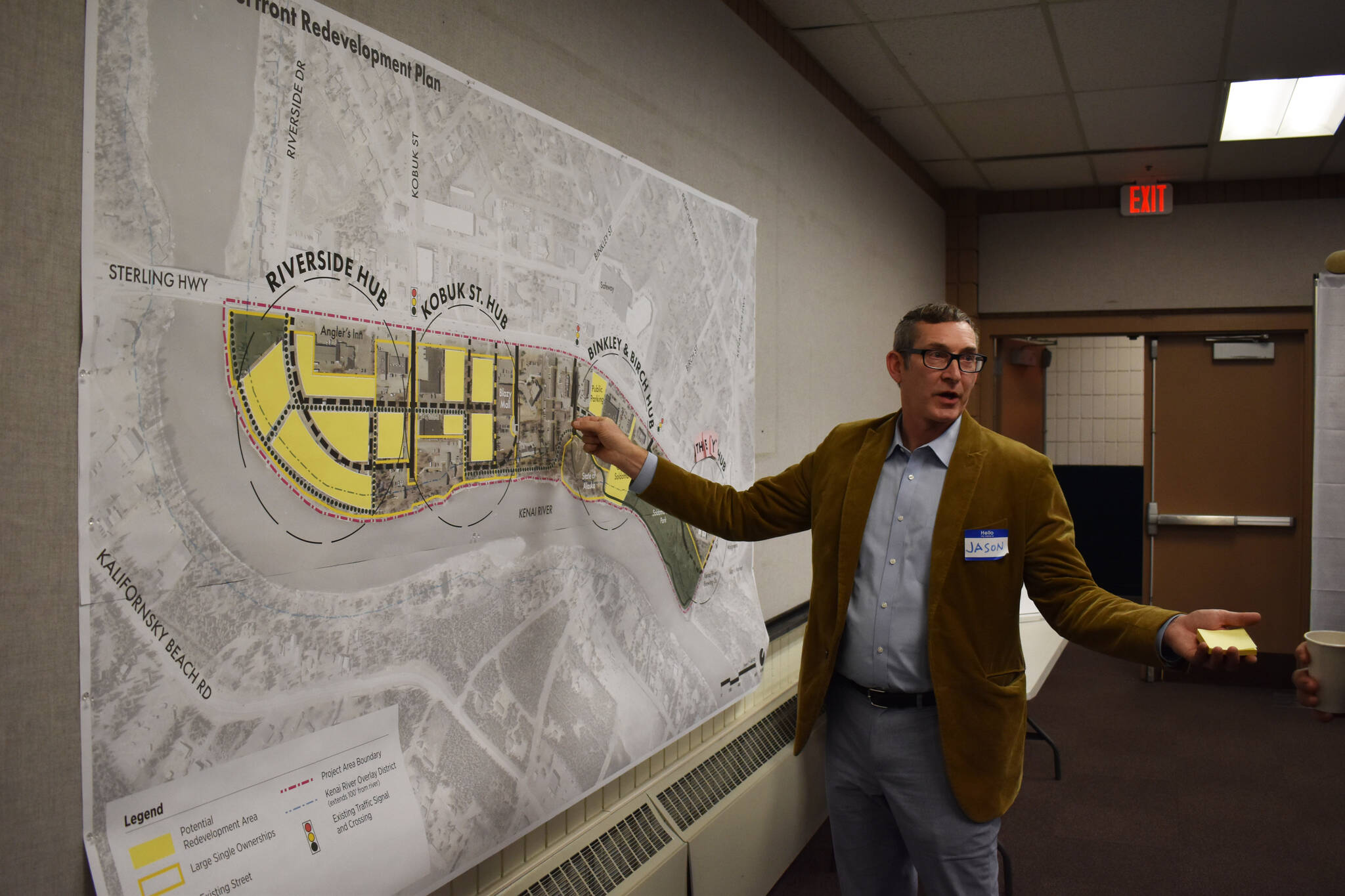Project Manager Jason Graf points to a map while answering questions from attendees on Thursday, Jan. 12, 2023, at the Soldotna Riverfront Redevelopment Open House at the Soldotna Regional Sports Complex in Soldotna, Alaska. (Jake Dye/Peninsula Clarion)