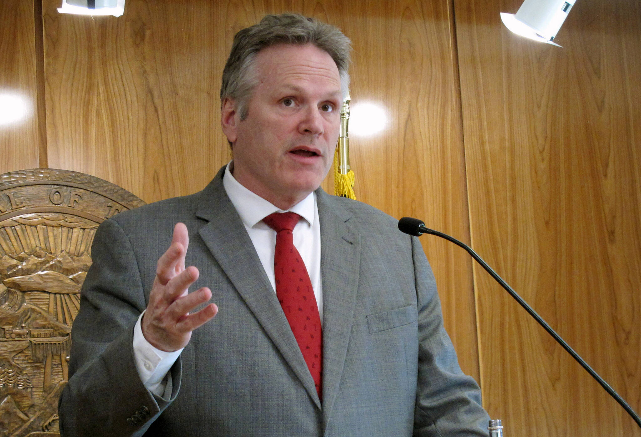 Alaska Gov. Mike Dunleavy speaks to reporters during a news conference at the state Capitol, April 28, 2022, in Juneau, Alaska. Dunleavy outlined proposed legislation Thursday, Jan. 12, 2023, for Alaska to capitalize on carbon markets, seeking to diversify state revenues long heavily reliant on proceeds from oil. (AP Photo/Becky Bohrer, File)