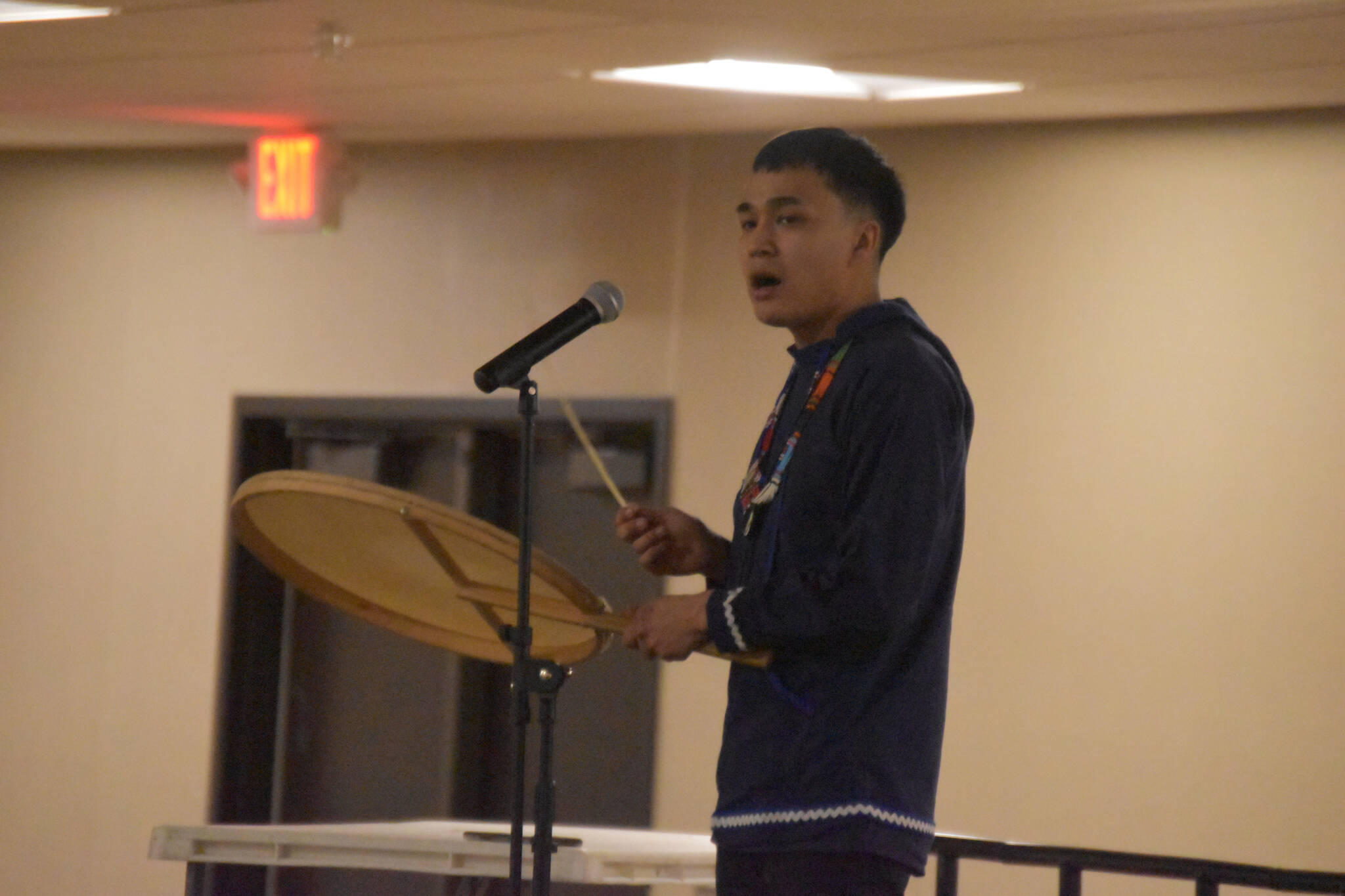 Byron Nicholai, of “I Sing, You Dance,” sings and drums during a musical performance as part of the Kahtnuht’ana Hey Chi’ula NYO Invitational on Saturday, Jan. 14, 2023, at the Kahtnuht’ana Duhdeldiht Campus in Kenai, Alaska. (Jake Dye/Peninsula Clarion)
