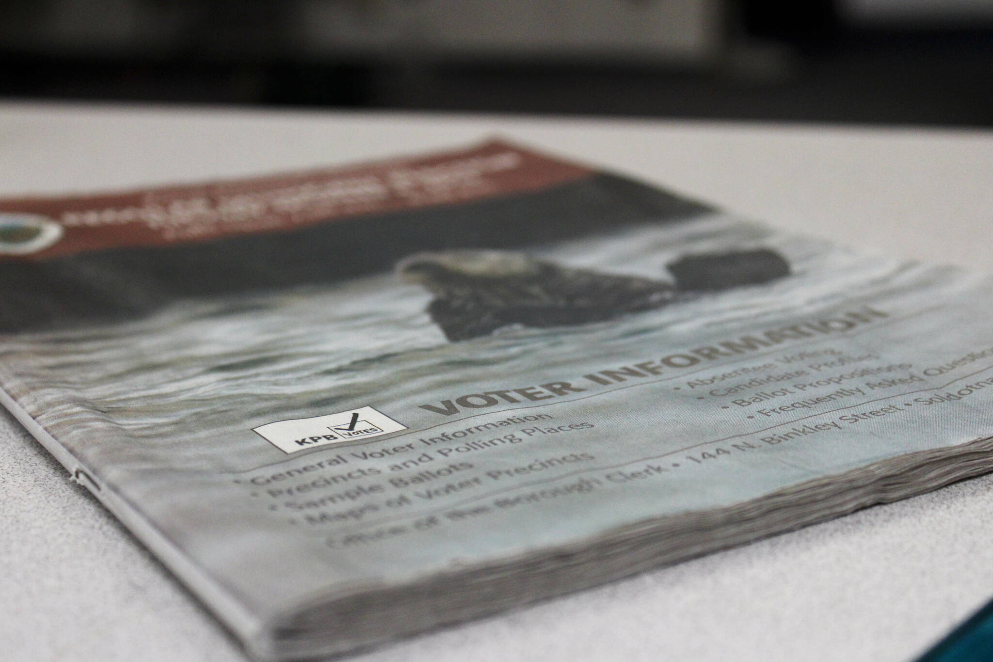 A 2022 voter information pamphlet rests on a desk in the Peninsula Clarion offices on Wednesday, Jan. 18, 2023, in Kenai, Alaska. (Ashlyn O’Hara/Peninsula Clarion)