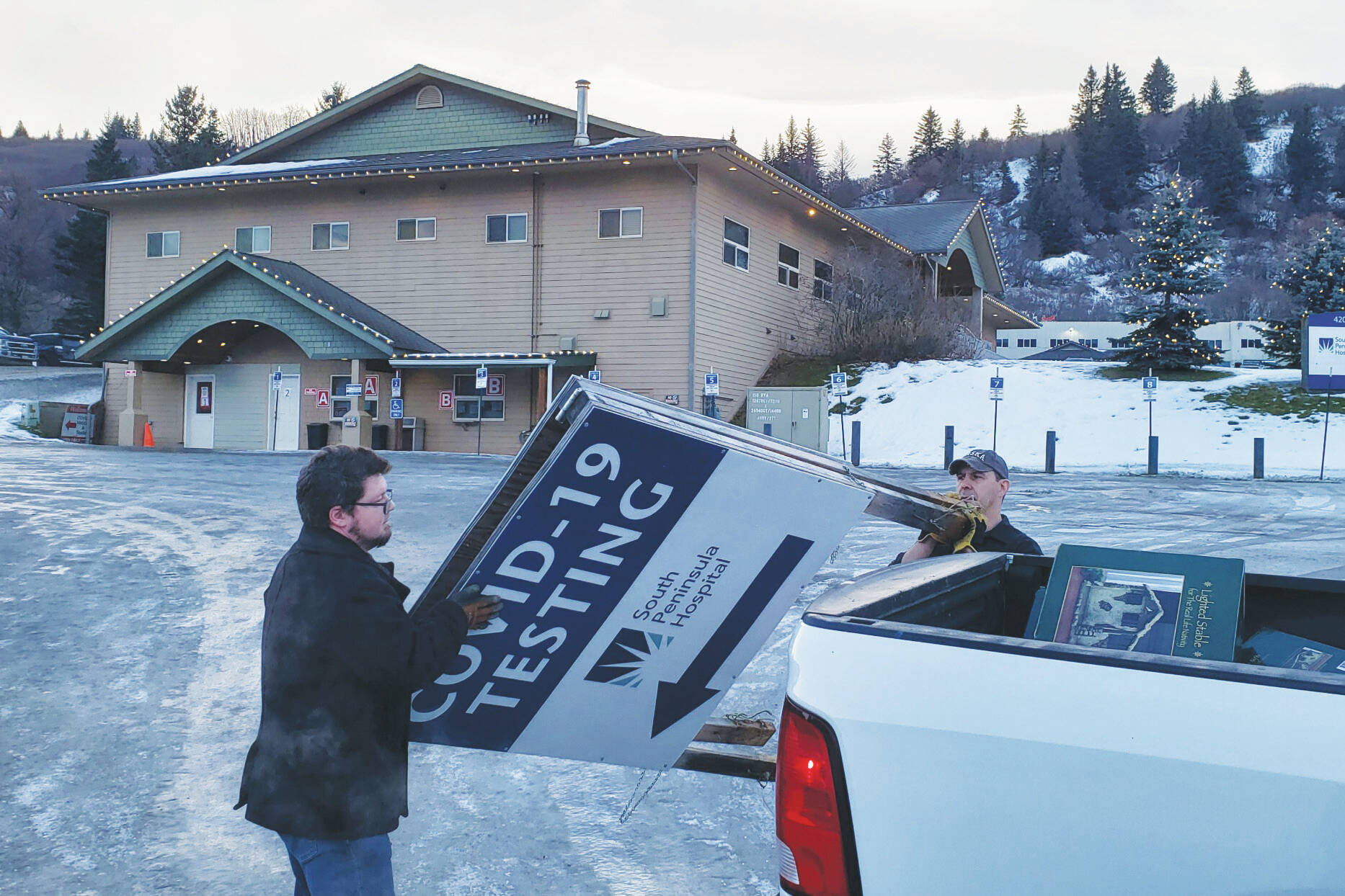 South Peninsula Hospital employees remove COVID-19 testing signs from South Peninsula Hospital test site Friday Jan. 13, 2023. (Photo from Derotha Ferraro/South Peninsula Hospital)