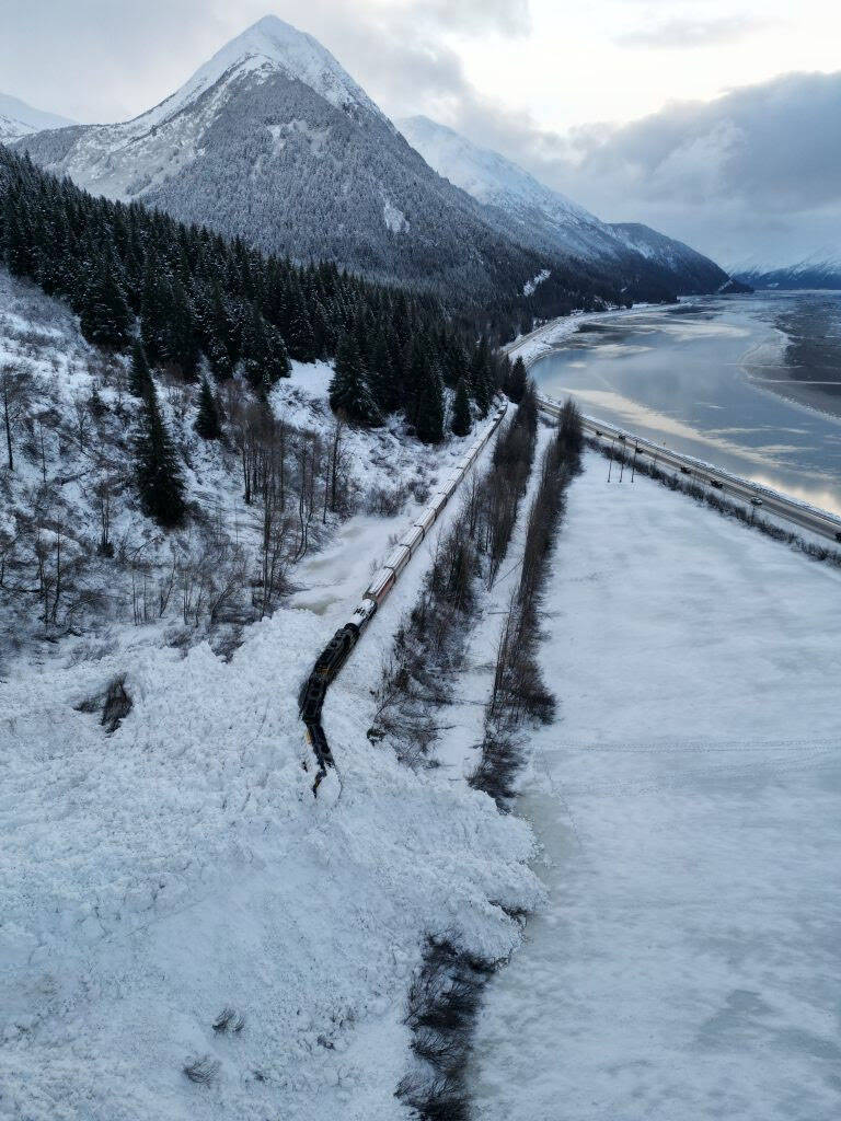 A train derailed by a large natural avalanche near Kern Creek is covered snow, Jan. 1, 2023, in Girdwood, Alaska. (Photo via Chugach Avalanche Center/Travis Smith)