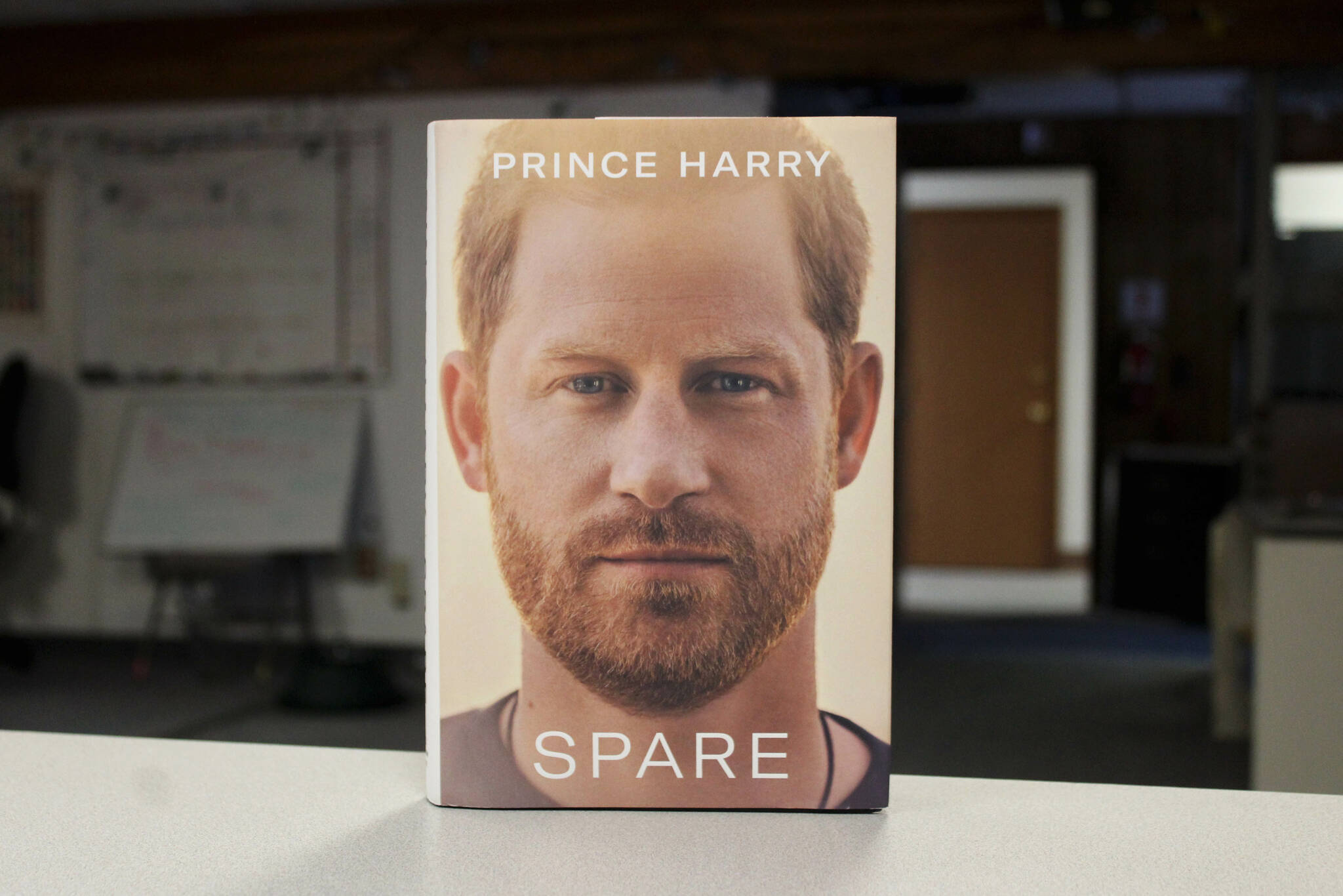 A copy of Prince Harry’s “Spare” sits on a desk in the Peninsula Clarion office on Tuesday, Jan. 24, 2023, in Kenai, Alaska. (Ashlyn O’Hara/Peninsula Clarion)