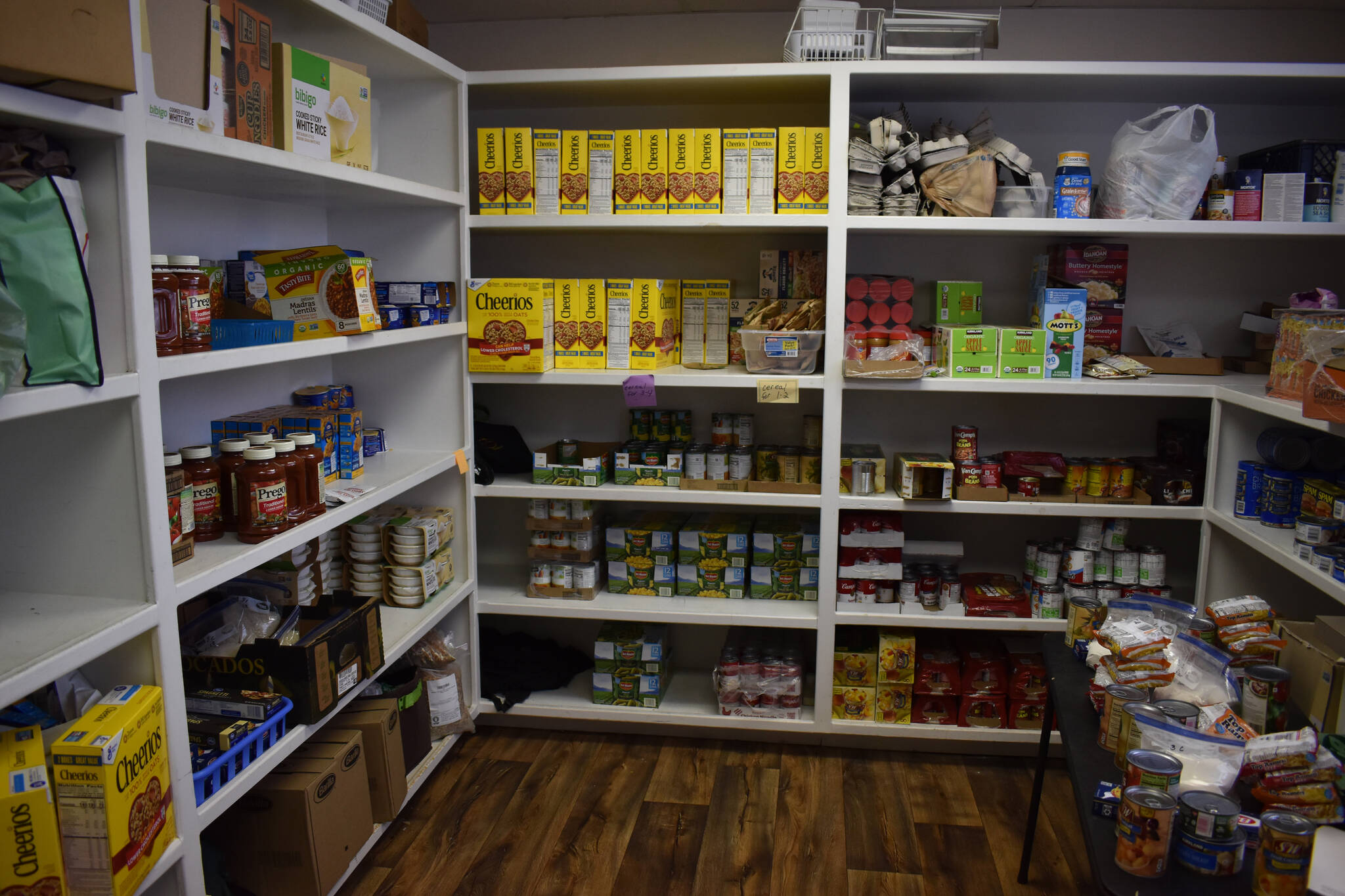 A variety of boxed, canned and contained food is stored at the Kenai United Methodist Food Pantry in Kenai, Alaska, on Monday, Jan. 23, 2022. (Jake Dye/Peninsula Clarion)
