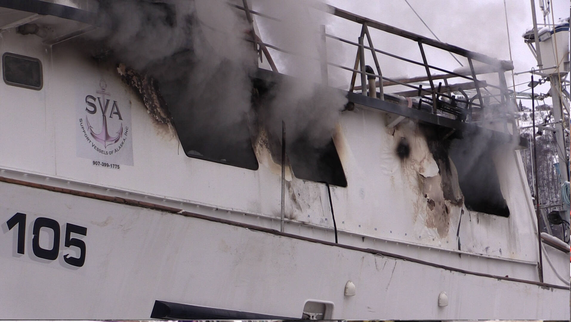 Smoke emerges from R/V Qualifier, which caught on fire in the Northern Enterprises Boatyard on Kachemak Drive, Jan. 19.