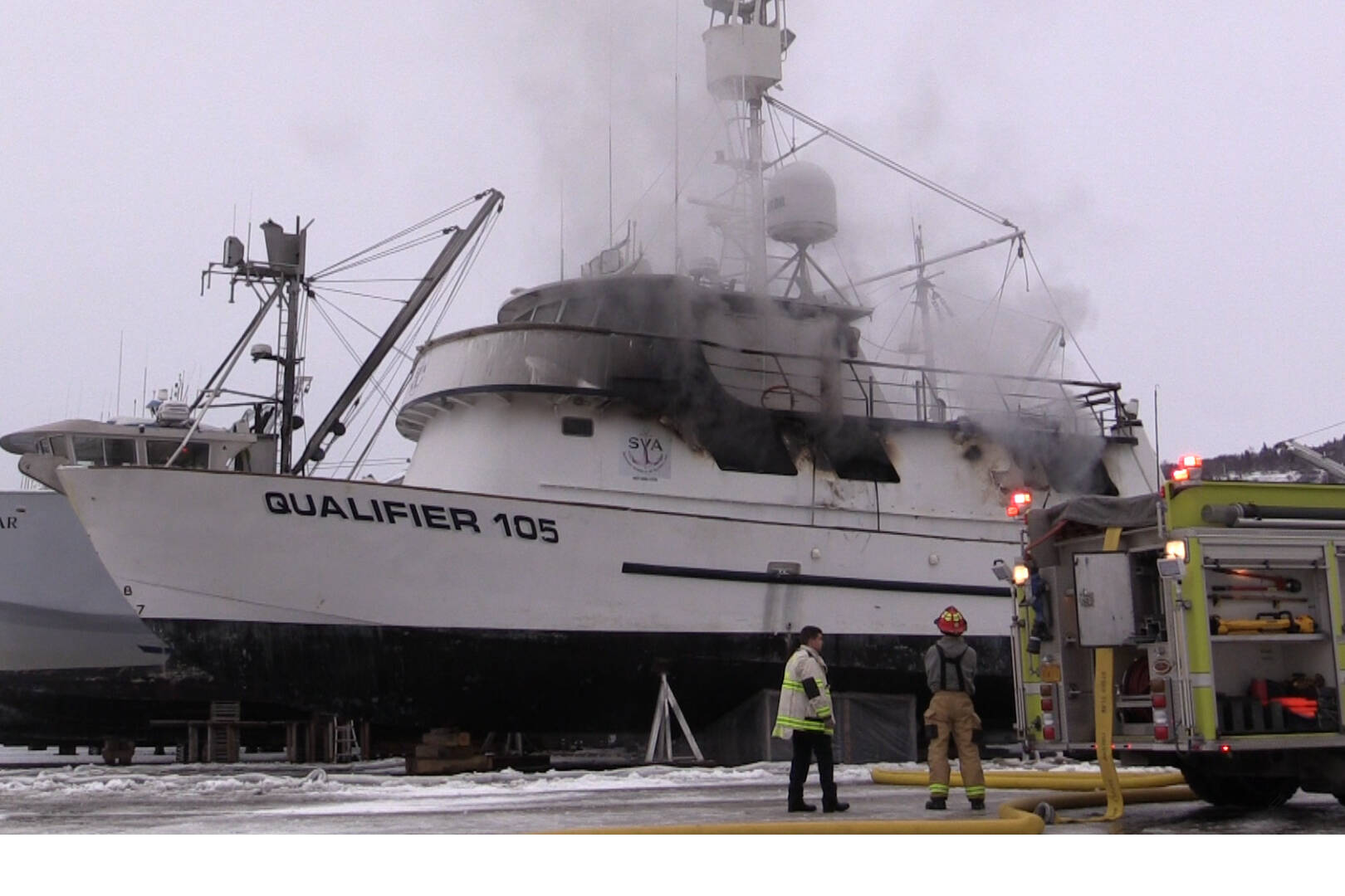 Emergency personnel respond to a fire on R/V Qualifier, in the Northern Enterprises Boatyard on Kachemak Drive, Jan. 19, 2023, in Homer, Alaska. (Photos by Nika Wolfe)