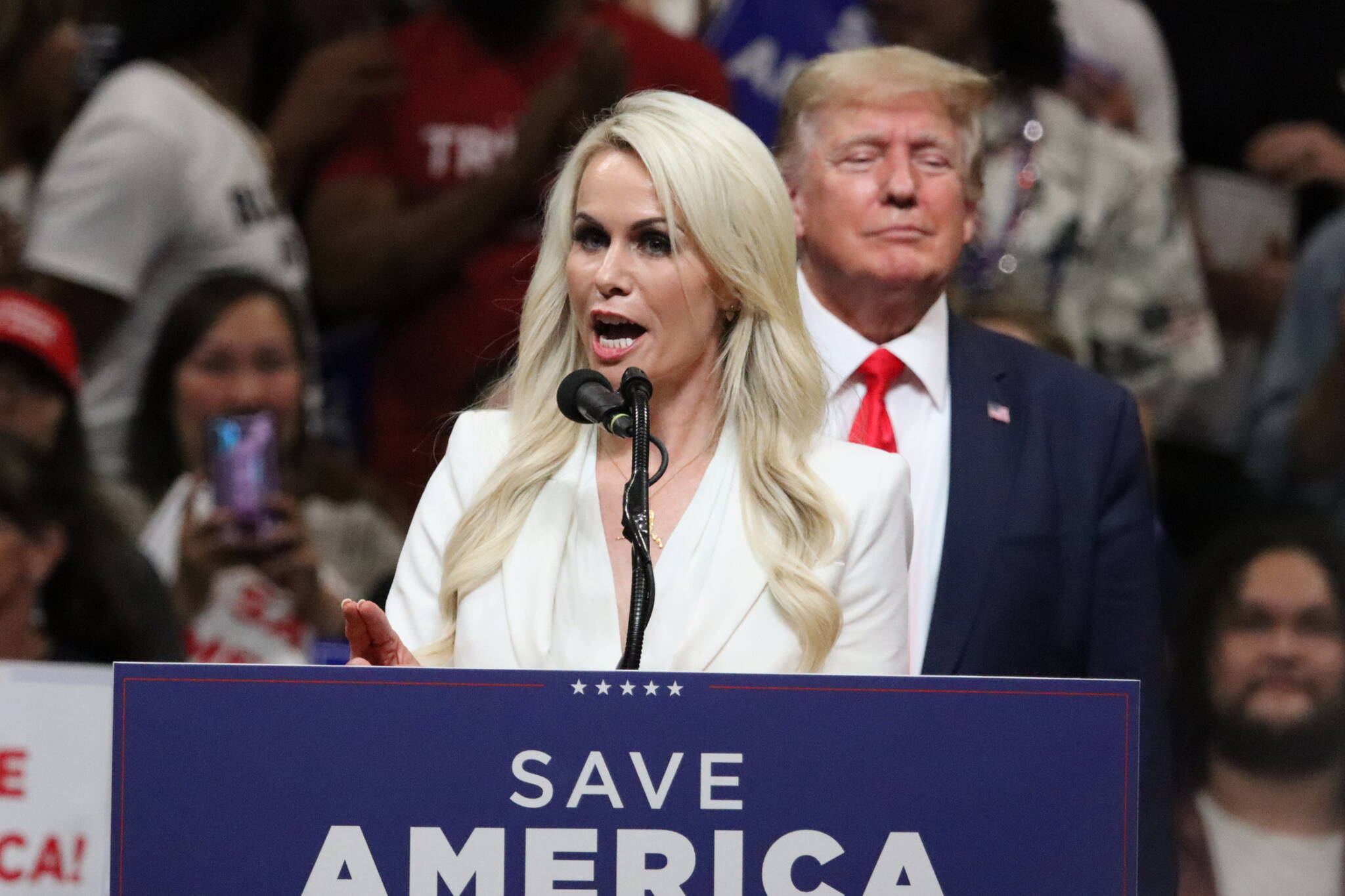 U.S. Senate candidate Kelly Tshibaka and former President Donald Trump stand on stage during a July 2022 rally in Anchorage. (Mark Sabbatini / Juneau Empire File)