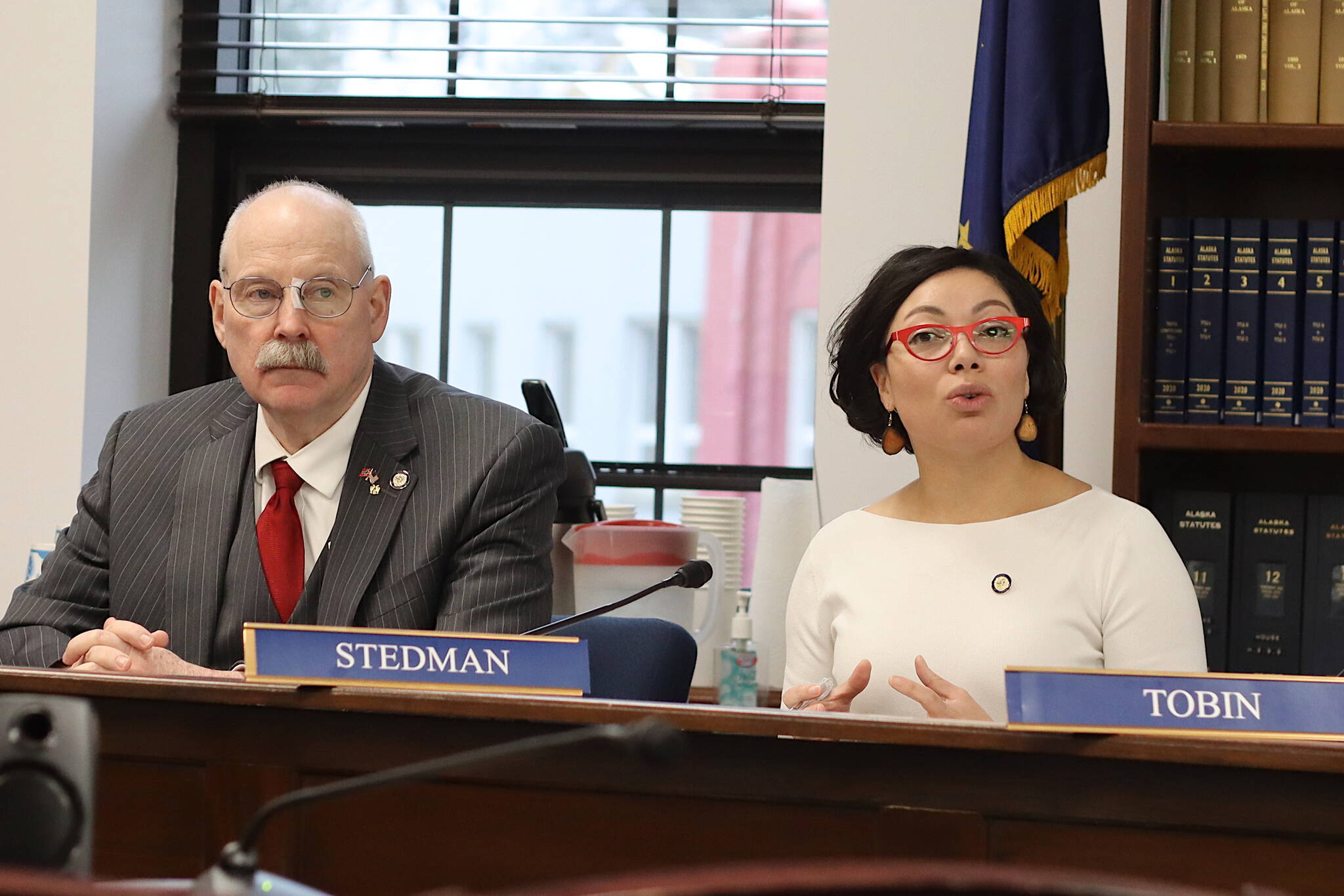 Sens. Löki Tobin, D-Anchorage, right, who chairs the Senate Education Committee, and Bert Stedman, R-Sitka, co-chair of the Senate Finance Committee, discuss a bill proposing a nearly 17% increase in per-student education funding Wednesday at the Alaska State Capitol. (Mark Sabbatini /Juneau Empire)