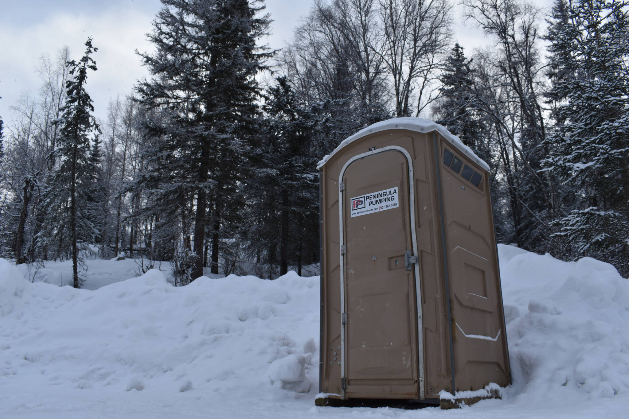 A recently added port-a-potty is available in the parking lot of Slikok Multi-Use Trails on Thursday, Feb. 2, 2023, in Soldotna, Alaska. (Jake Dye/Peninsula Clarion)