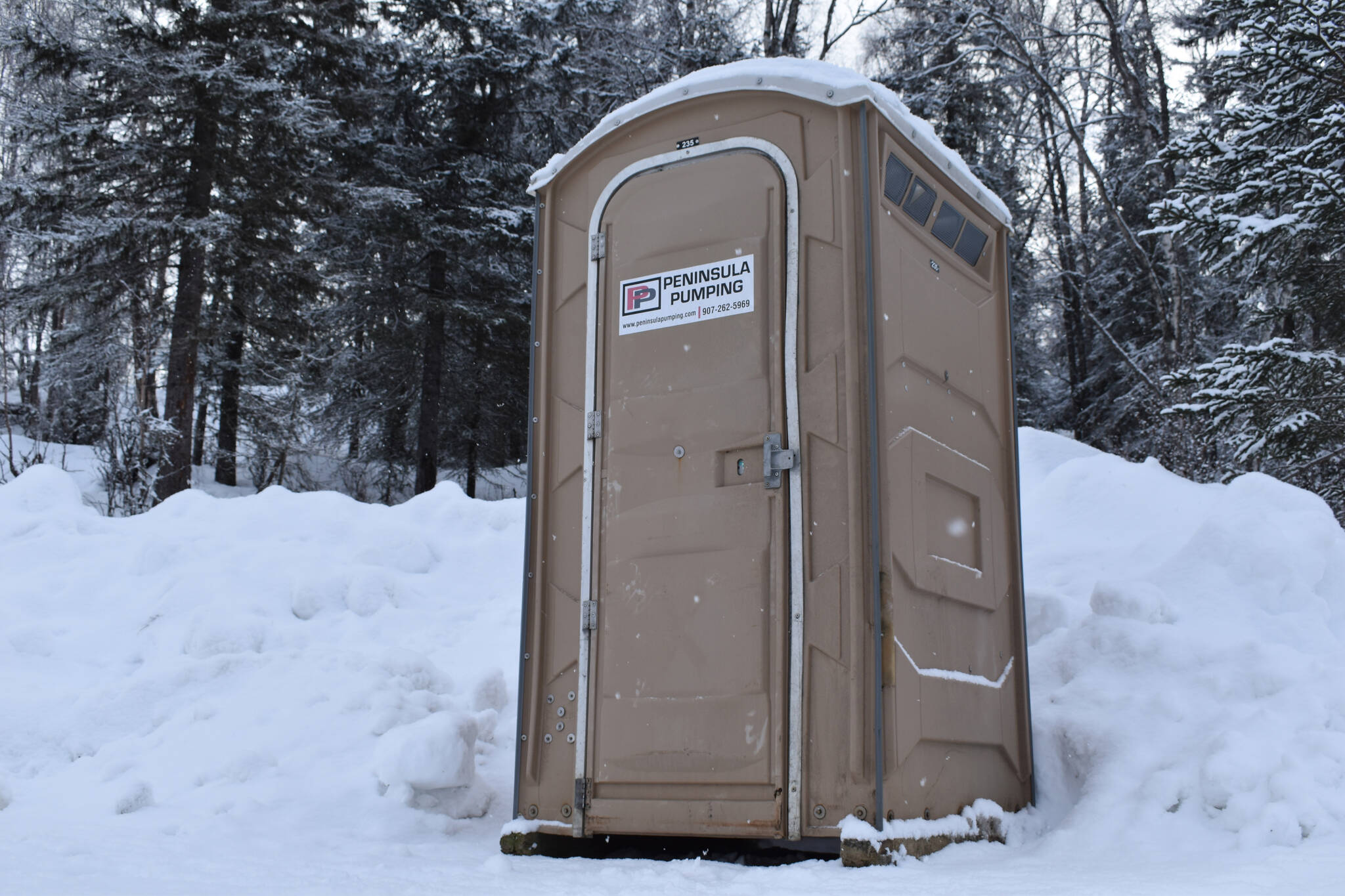 A recently added port-a-potty is available in the parking lot of Slikok Multi-Use Trails on Thursday, Feb. 2, 2023, in Soldotna, Alaska. (Jake Dye/Peninsula Clarion)