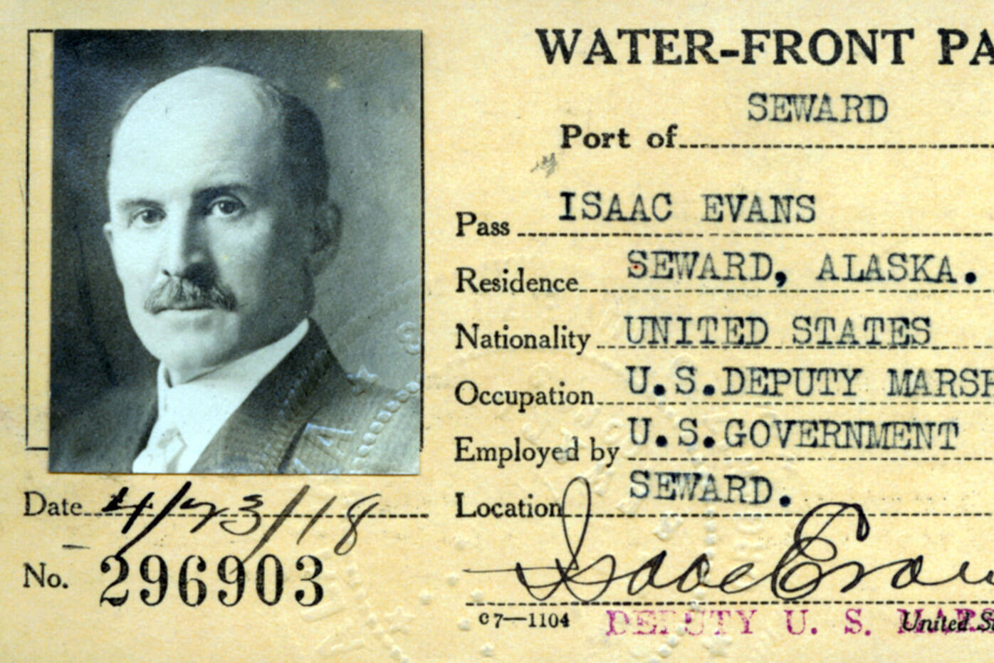 In 1918, a year before he would be gunned down on the streets of Seward, U.S. Deputy Marshal Isaac Evans posed for this photo on his Port of Seward waterfront pass. (Image courtesy of the Resurrection Bay Historical Society)