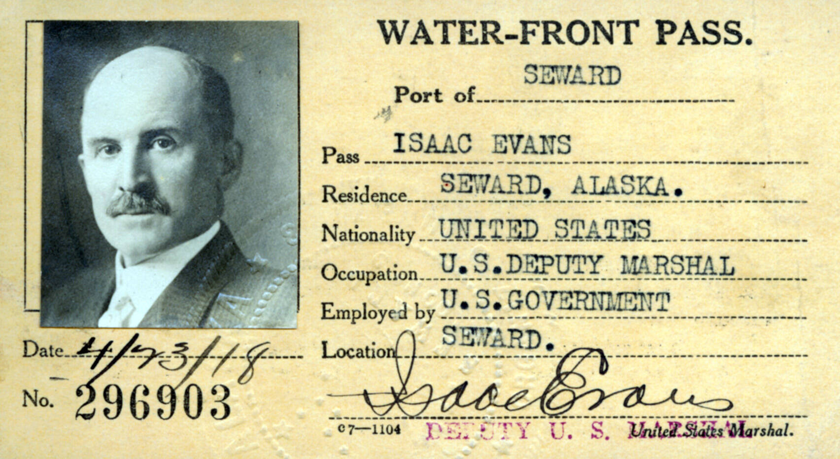 In 1918, a year before he would be gunned down on the streets of Seward, U.S. Deputy Marshal Isaac Evans posed for this photo on his Port of Seward waterfront pass. (Image courtesy of the Resurrection Bay Historical Society)