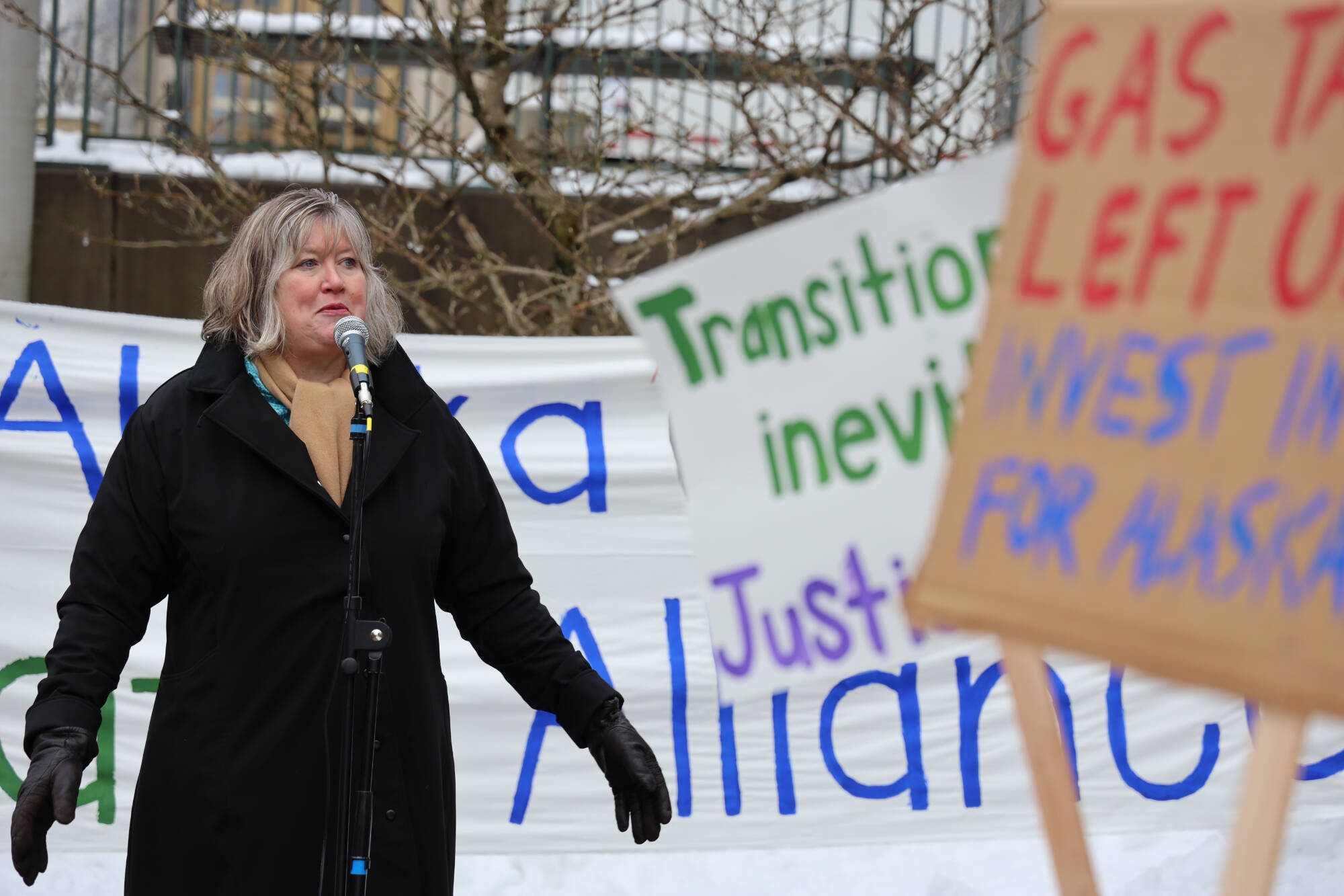 Rep. Sara Hannan of Juneau speaks to a crowd of climate activists who held a rally outside the Alaska State Capitol Friday, Feb. 3, 2023, to advocate for legislative action to improve Alaska’s renewable energy development and future sustainability. (Clarise Larson / Juneau Empire)