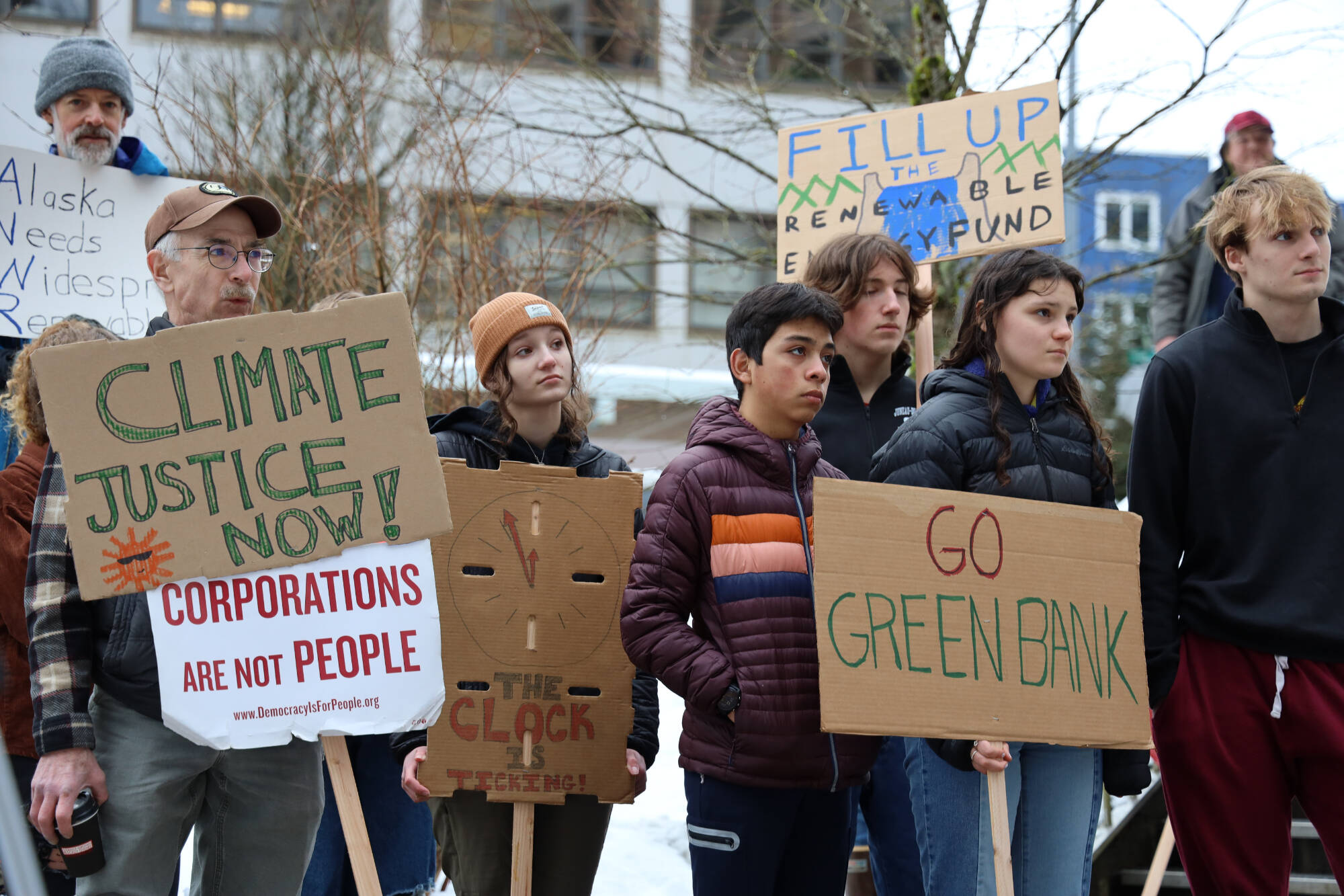 Climate activists hold a rally outside the Alaska State Capitol on Friday, Feb. 3, 2023, to advocate for legislative action to improve Alaska’s renewable energy development and future sustainability. ( Clarise Larson / Juneau Empire)