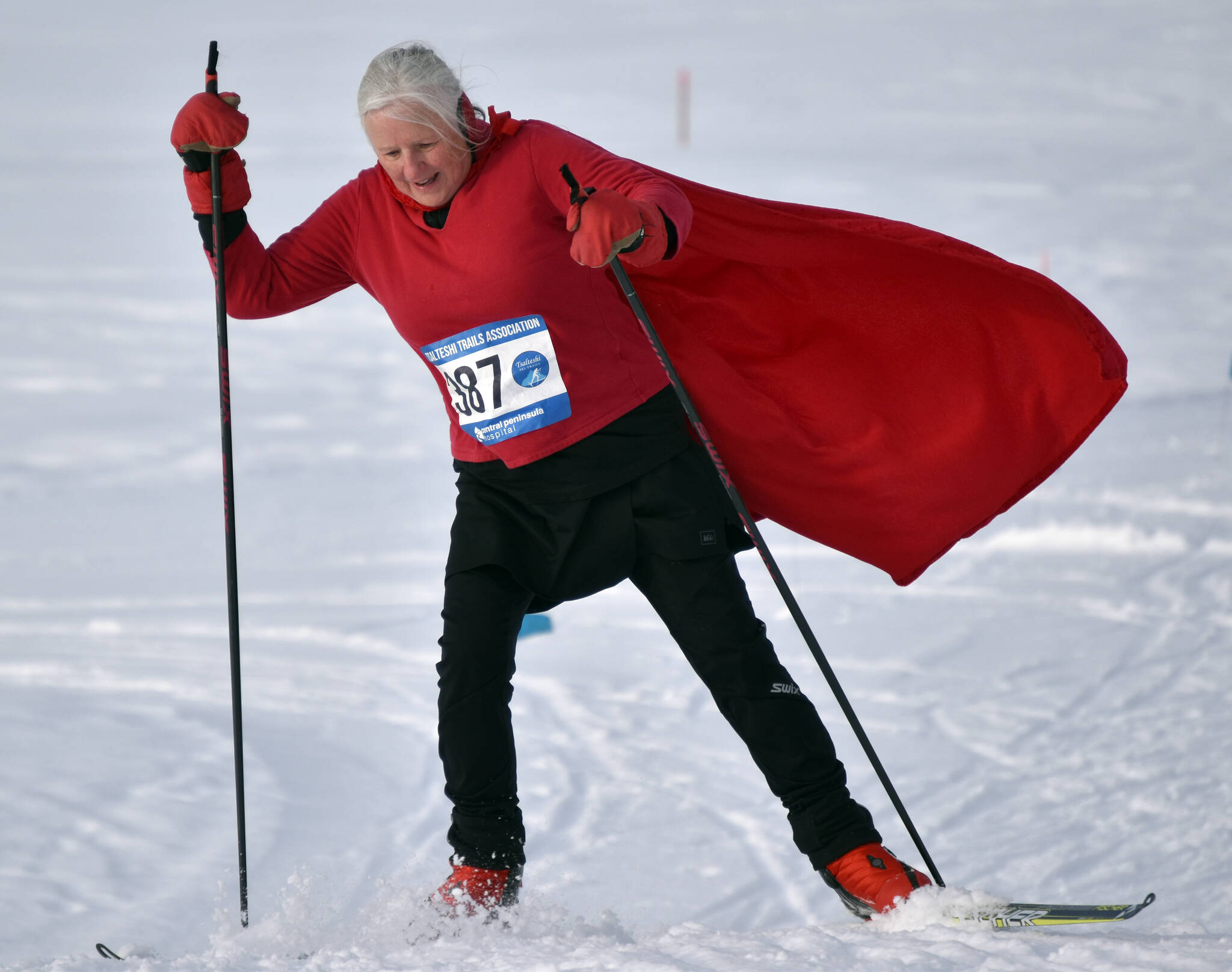 Leslie Boyd, dressed as Little Red Riding Hood, climbs a hill at the 19th annual Ski For Women on Sunday at Tsalteshi Trails just outside of Soldotna. Boyd, with Gigi Banas as Grandma, Sue Seggerman as the Woodcutter and Sara Mahood as the Wolf, were part of the winning costume of “Little Red Riding Hood and the Big Bad Wolf.”