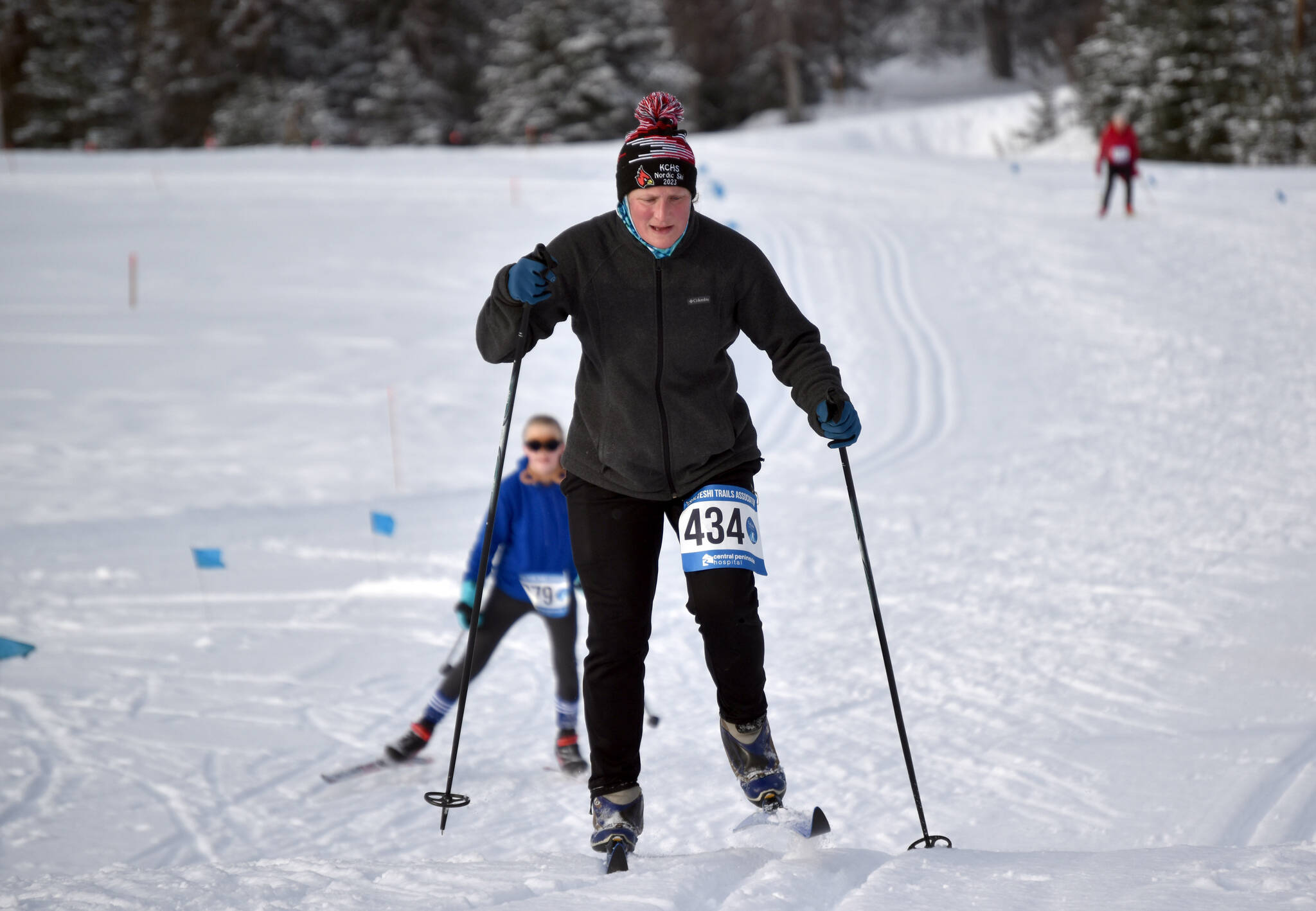 Julie Laker, the winner of the 5-kilometer classic race, climbs a hill at the 19th annual Ski For Women on Sunday, Feb. 12, 2023, at Tsalteshi Trails just outside of Soldotna, Alaska. (Photo by Jeff Helminiak/Peninsula Clarion)