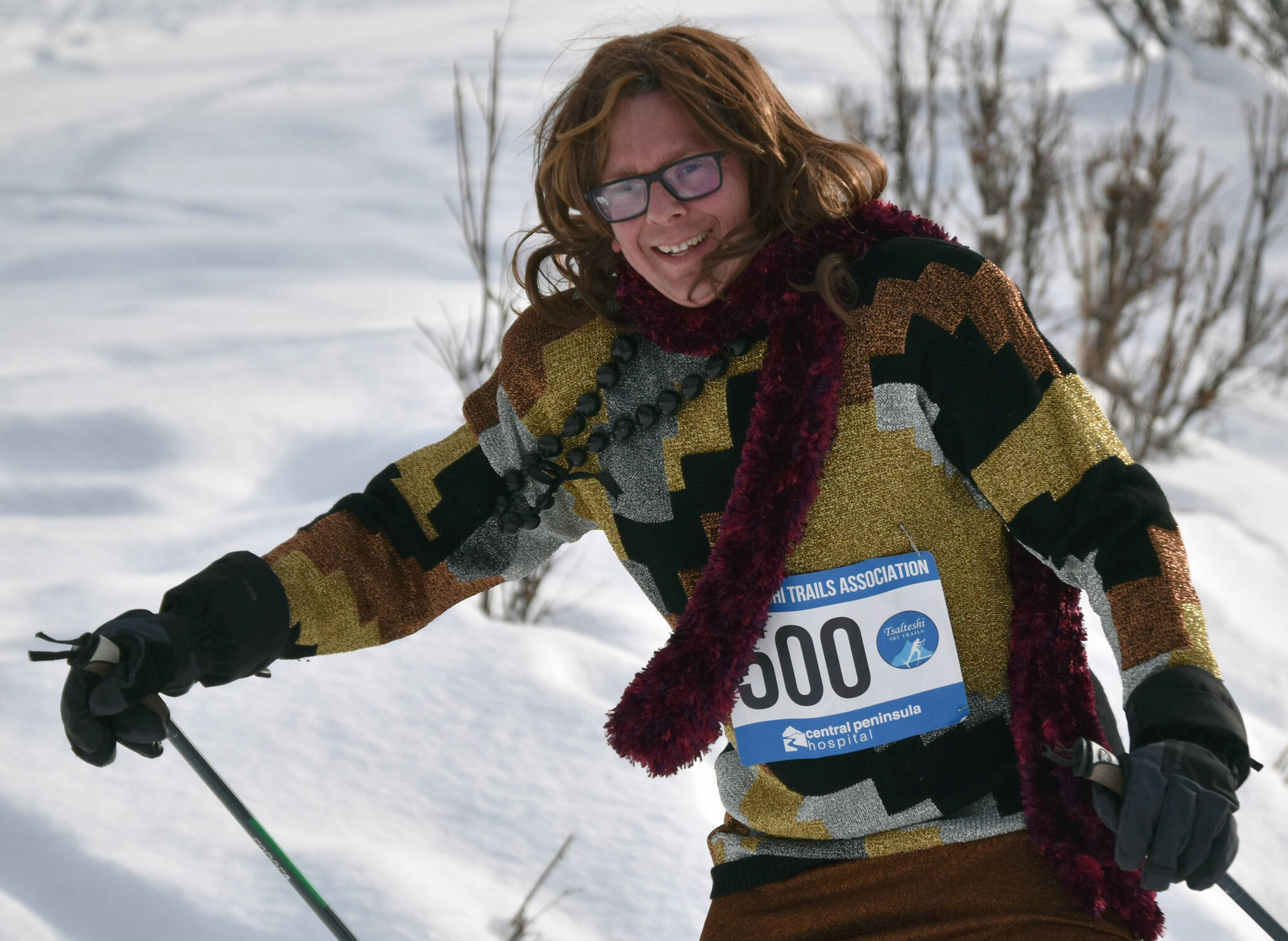 C.O. Rudstrom climbs a hill at the 19th annual Ski For Women on Sunday, Feb. 12, 2023, at Tsalteshi Trails just outside of Soldotna, Alaska. Rudstrom won the Fiercest Drag award. (Photo by Jeff Helminiak/Peninsula Clarion)