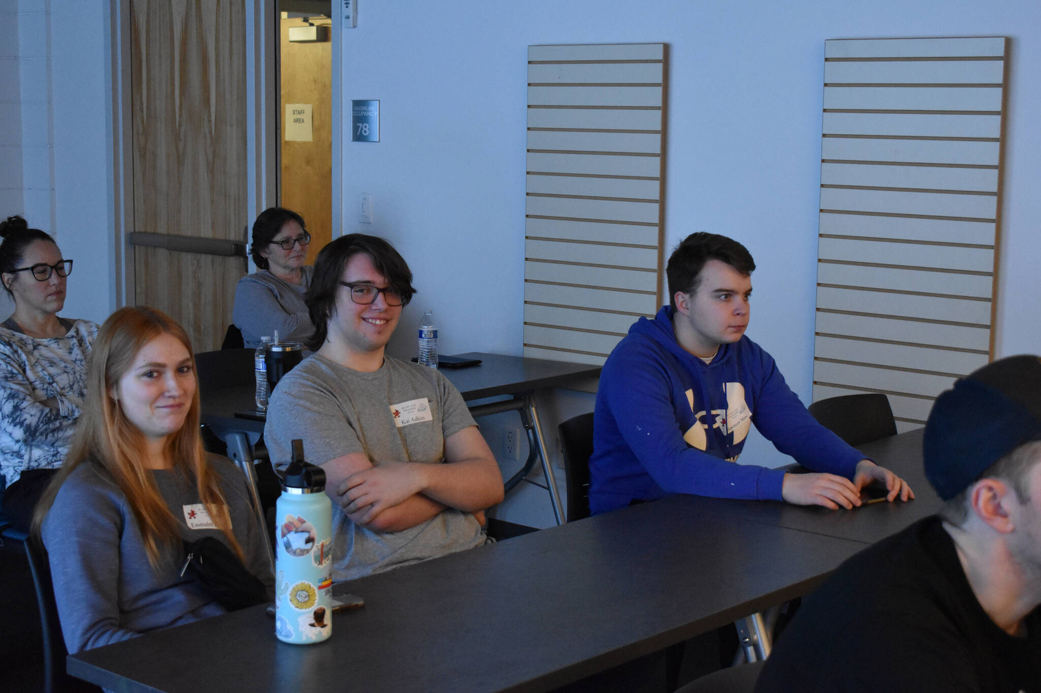 Emmalee Roney, Kai Adkins and Spencer Maw participate in Job Shadow Day, following Kenai Fire Department staff at the Kenai Community Library, in Kenai, Alaska, on Wednesday, Feb. 15, 2023. (Landon Dubber/Peninsula Clarion)