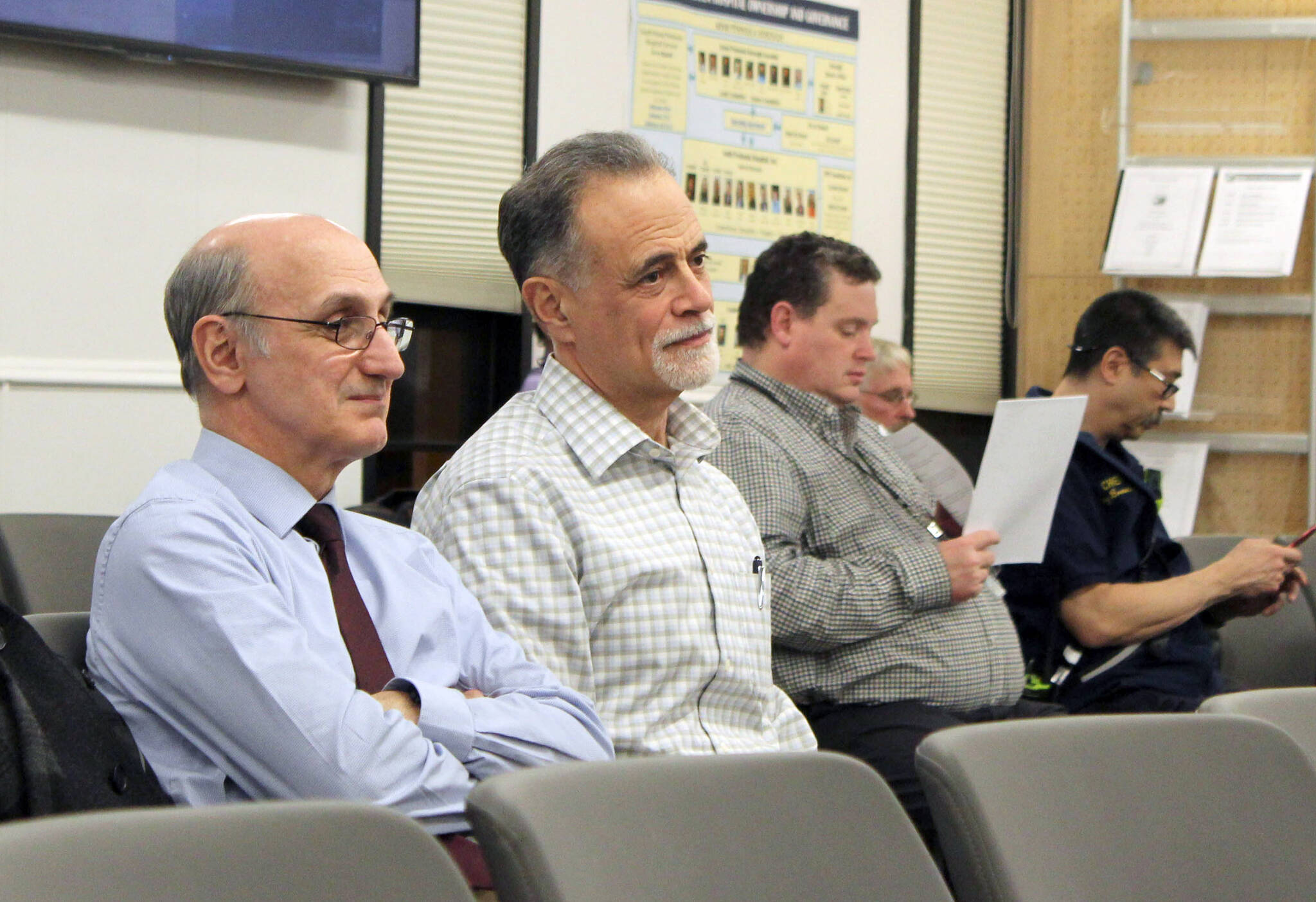 Ashlyn O’Hara/Peninsula Clarion
Peter Micciche (center) listens to the Kenai Peninsula Borough Assembly certify the results of the Feb. 14, 2023, special mayoral election, through which he was elected mayor of the Kenai Peninsula Borough, on Tuesday in Soldotna.