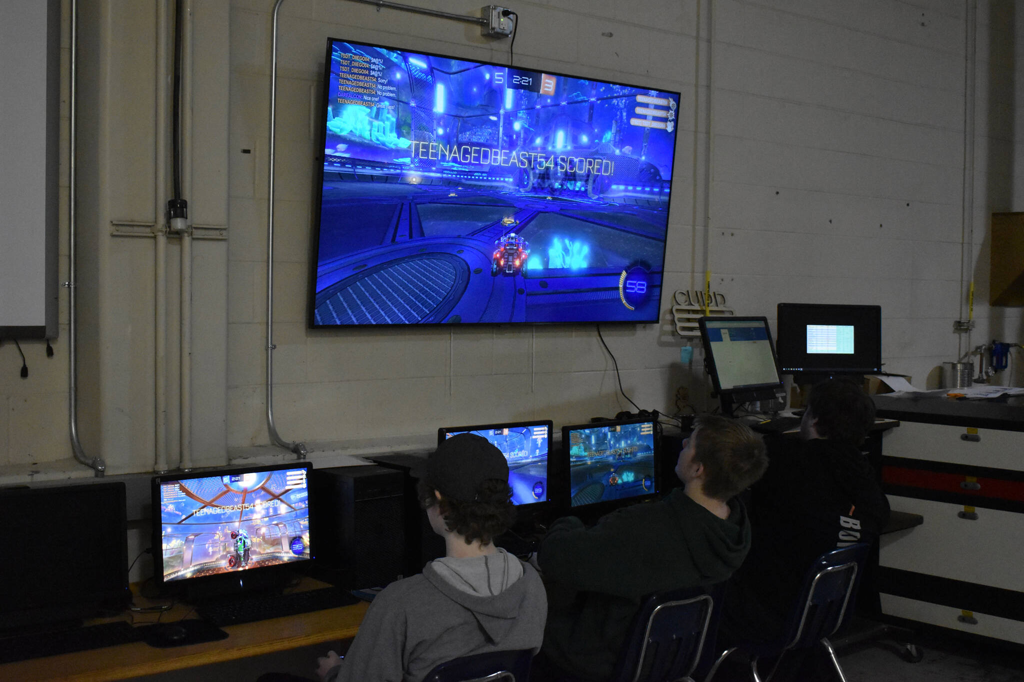 Soldotna High School esports players Ethan Boehme, Graehm LeFevre and Bryce LeFevre participate in a Rocket League practice match on Thursday, Feb. 23, 2023, at Skyview Middle School in Soldotna, Alaska. (Jake Dye/Peninsula Clarion)