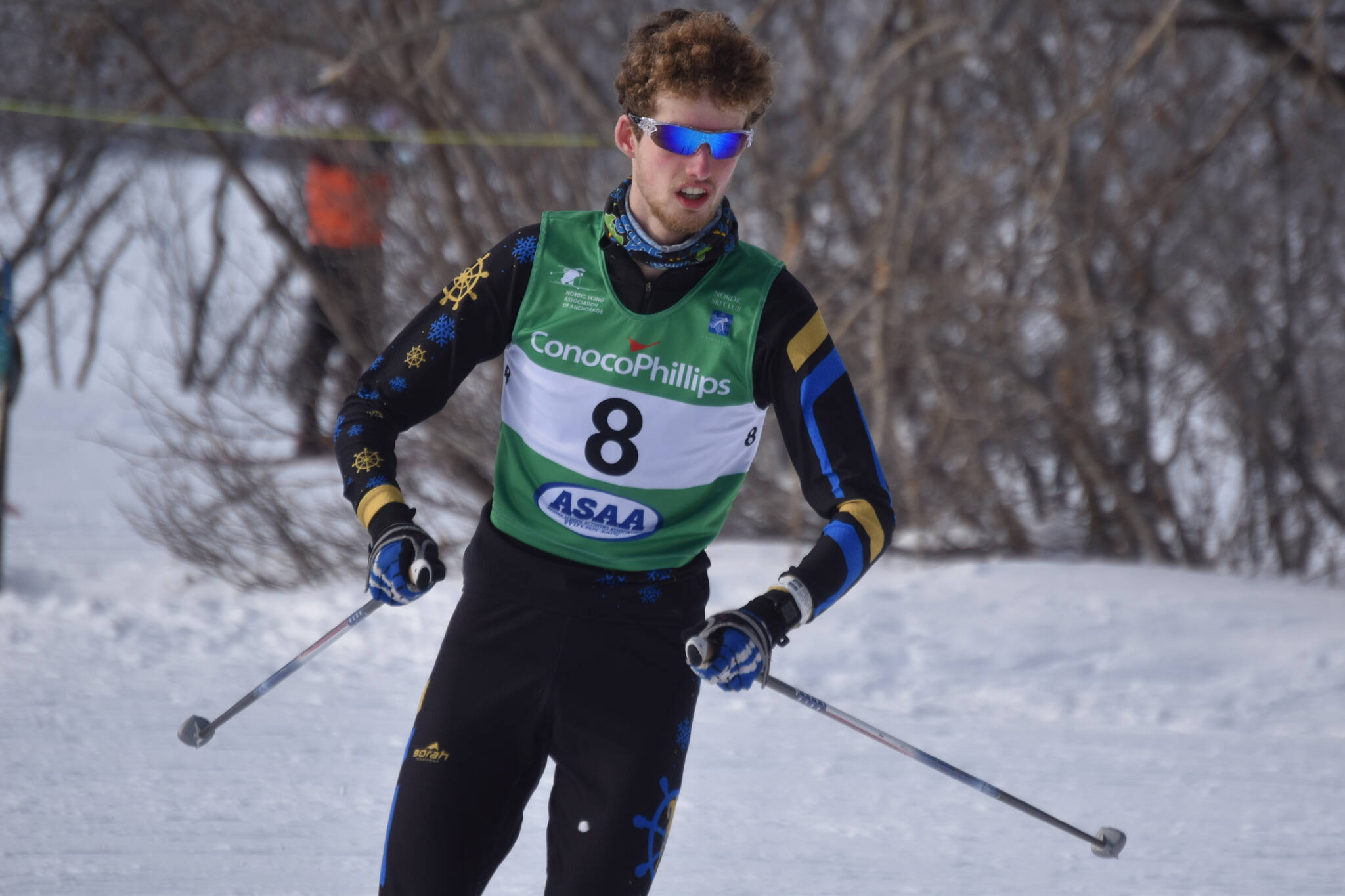 Seamus McDonough, of Homer, rounds a bend during the boys 4x5-kilometer relay at the ASAA State Nordic Ski Championships at Kincaid Park in Anchorage, Alaska, on Saturday, Feb. 25, 2023. (Jake Dye/Peninsula Clarion)