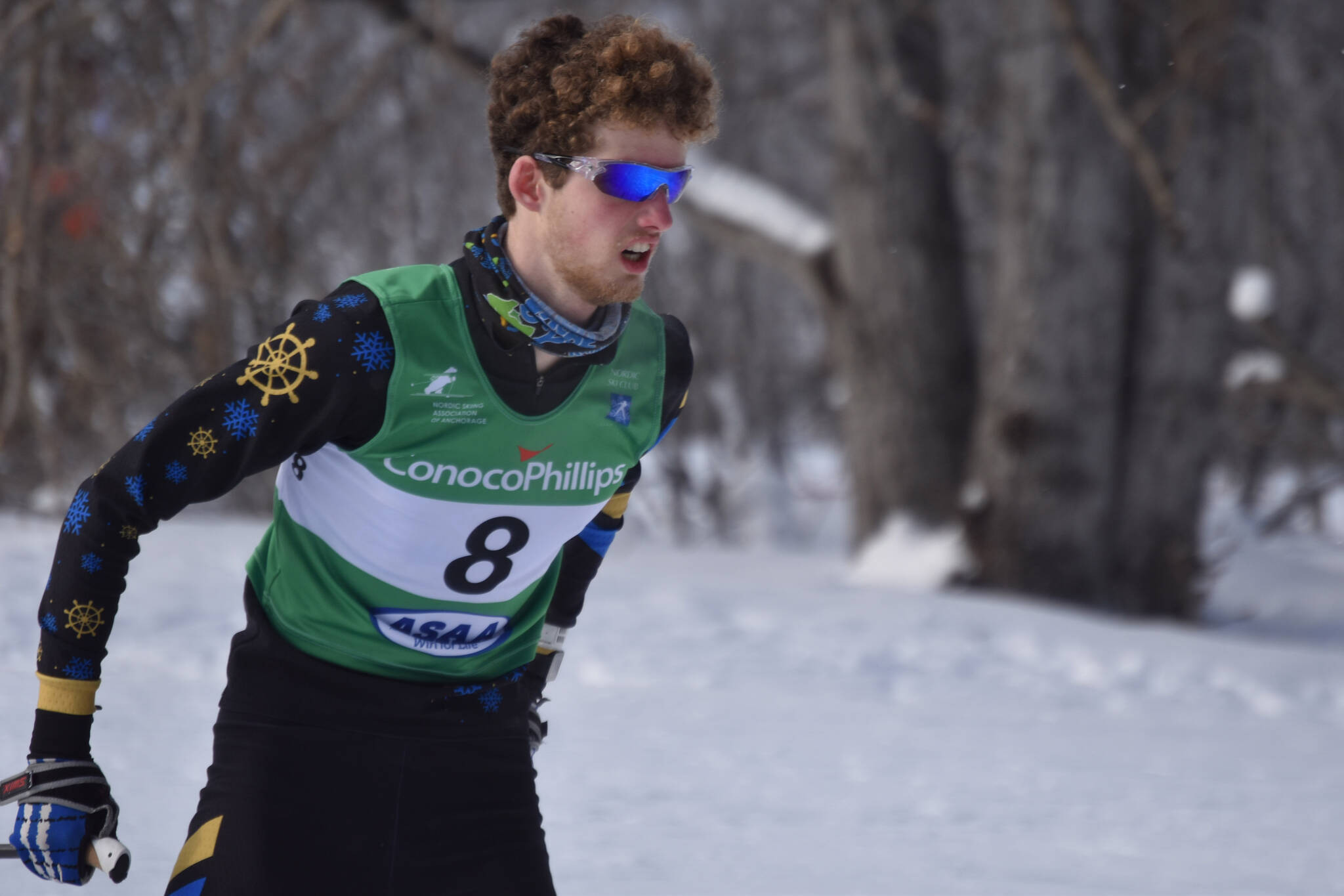 Seamus McDonough, of Homer, rounds a bend during the boys 4x5-kilometer relay at the ASAA State Nordic Ski Championships at Kincaid Park in Anchorage, Alaska, on Saturday, Feb. 25, 2023. (Jake Dye/Peninsula Clarion)
