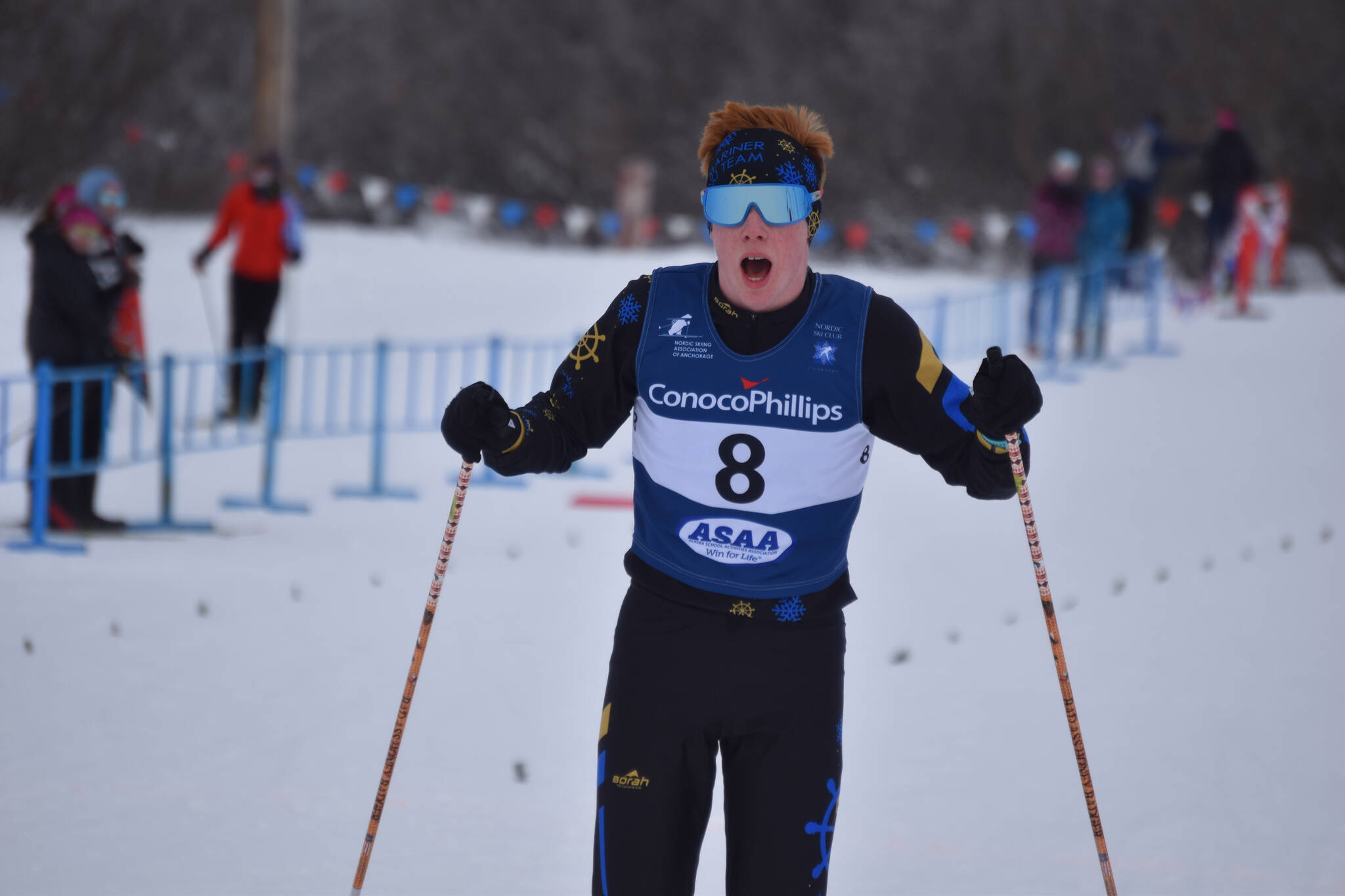 Jody Goodrich gasps for breath as he slows to a stop in the finish chute after the final leg of the boys 4x5-kilometer relay at the ASAA State Nordic Ski Championships at Kincaid Park in Anchorage, Alaska, on Saturday, Feb. 25, 2023. (Jake Dye/Peninsula Clarion)