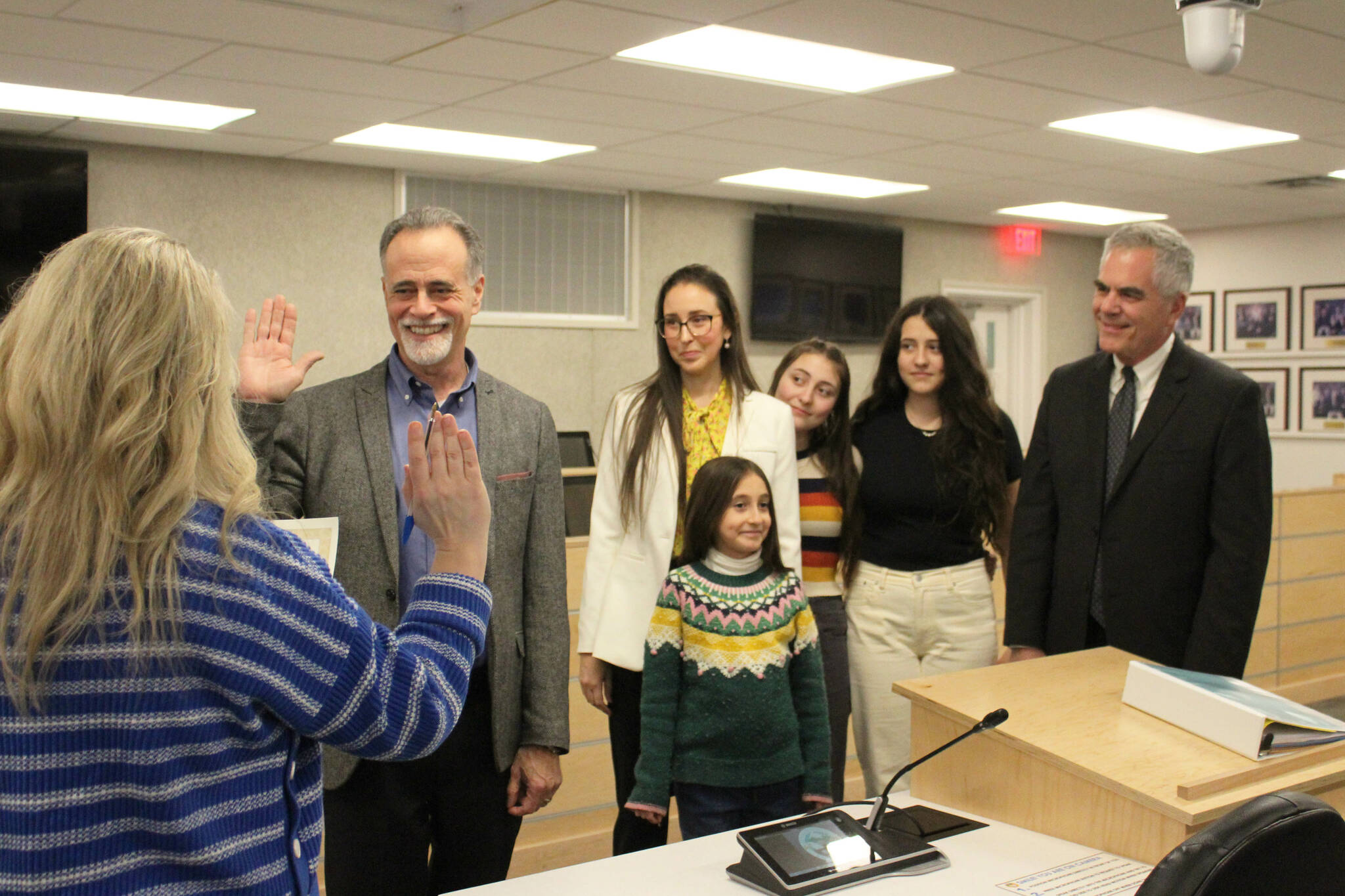 Peter Micciche (second from left) is sworn in as mayor of the Kenai Peninsula Borough on Monday, Feb. 27, 2023 in Soldotna, Alaska. (Ashlyn O’Hara/Peninsula Clarion)