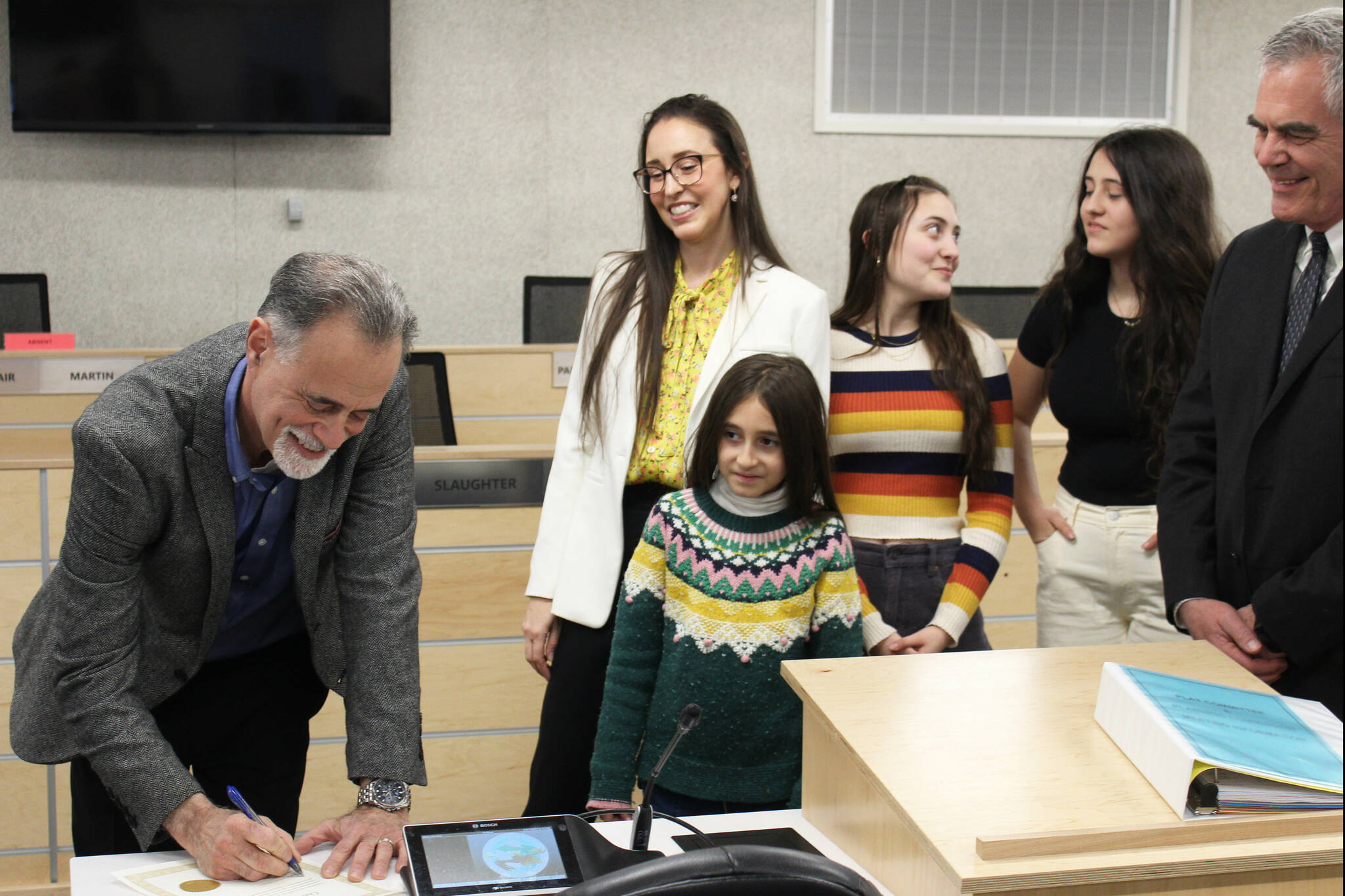 Peter Micciche signs his oath of office after being sworn in as mayor of the Kenai Peninsula Borough on Monday, Feb. 27, 2023 in Soldotna, Alaska. (Ashlyn O’Hara/Peninsula Clarion)