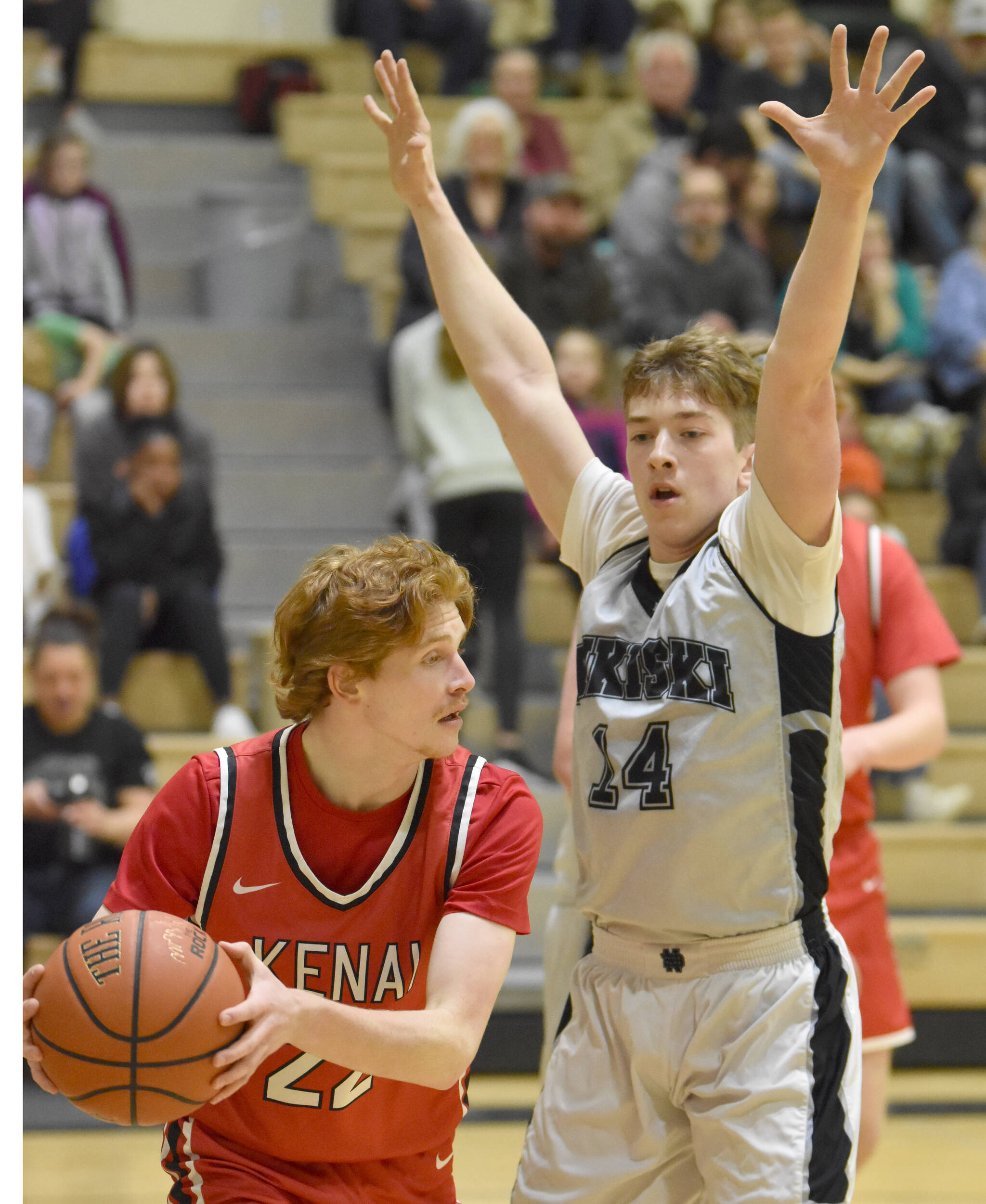 Nikiski’s Braeden Porter defends Kenai Central’s Wade James on Tuesday, Feb. 28, 2023, at Nikiski Middle-High School in Nikiski, Alaska. (Photo by Jeff Helminiak/Peninsula Clarion)