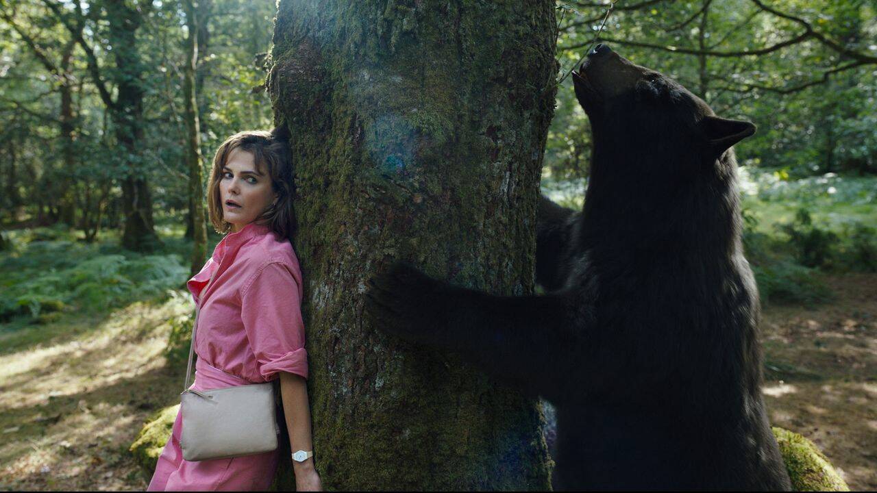 Keri Russell’s Sari hides from the Cocaine Bear in “Cocaine Bear.” (Photo courtesy Universal Pictures)