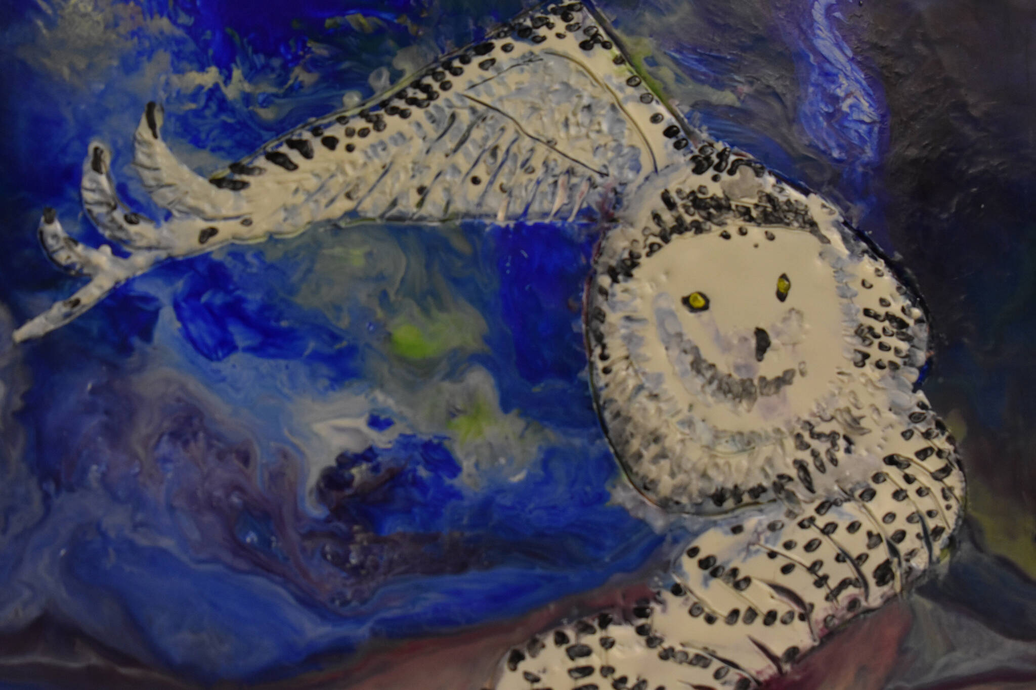 A painting of a white owl is seen hanging on Feb. 28, 2023, at the Kenai Art Center in Kenai, Alaska, part of “Bird Call,” the center’s March show. (Jake Dye/Peninsula Clarion)