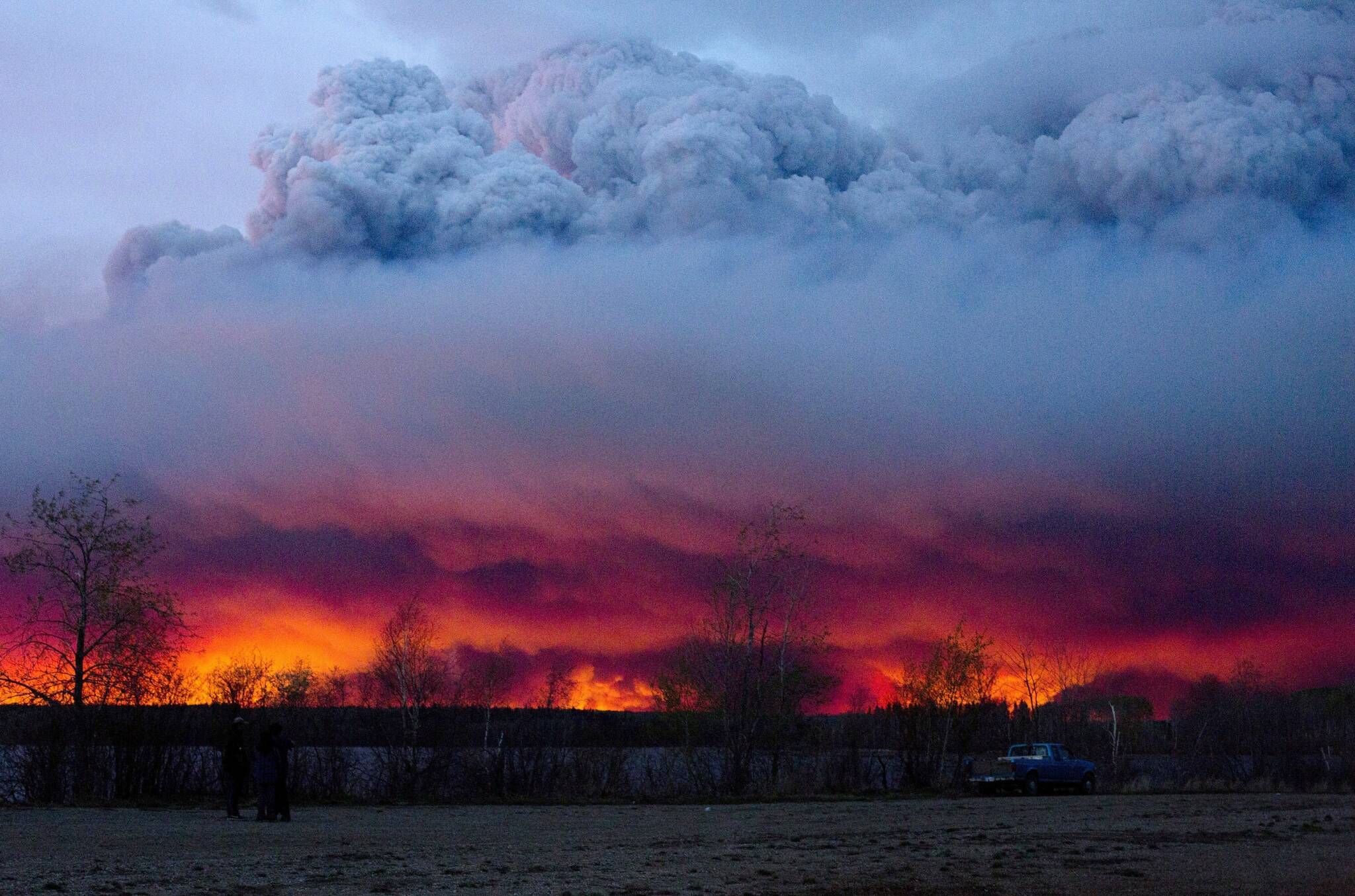 A wildfire moves towards the town of Anzac from Fort McMurray, Alberta., on May 4, 2016. Smoke from boreal fires in 2021 contributed the most to global fire CO2 emissions since 2000, according to a new study in Science being released with a press briefing at the annual AAAS meeting. Using satellite-based atmospheric measurements, researchers from around the world determined that boreal fire smoke made up 23% of global fire CO2 emissions when it typically accounts for 10% of these emissions. (Jason Franson/The Canadian Press via AP, file)
