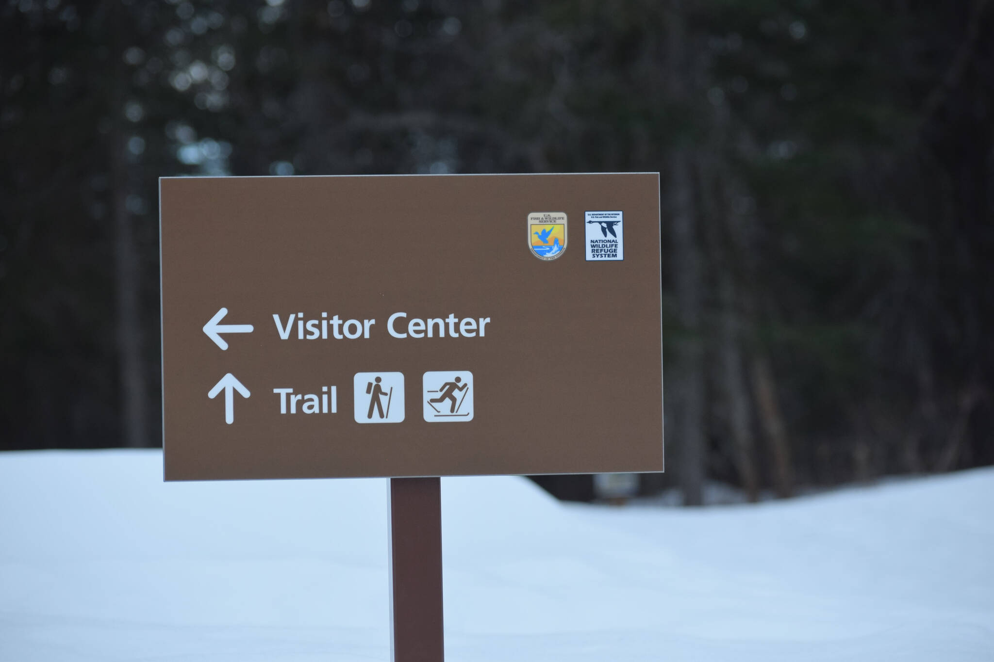 A sign to Kenai National Wildlife Refuge trails is seen Wednesday, March 23, 2022, in Soldotna, Alaska. (Camille Botello/Peninsula Clarion)