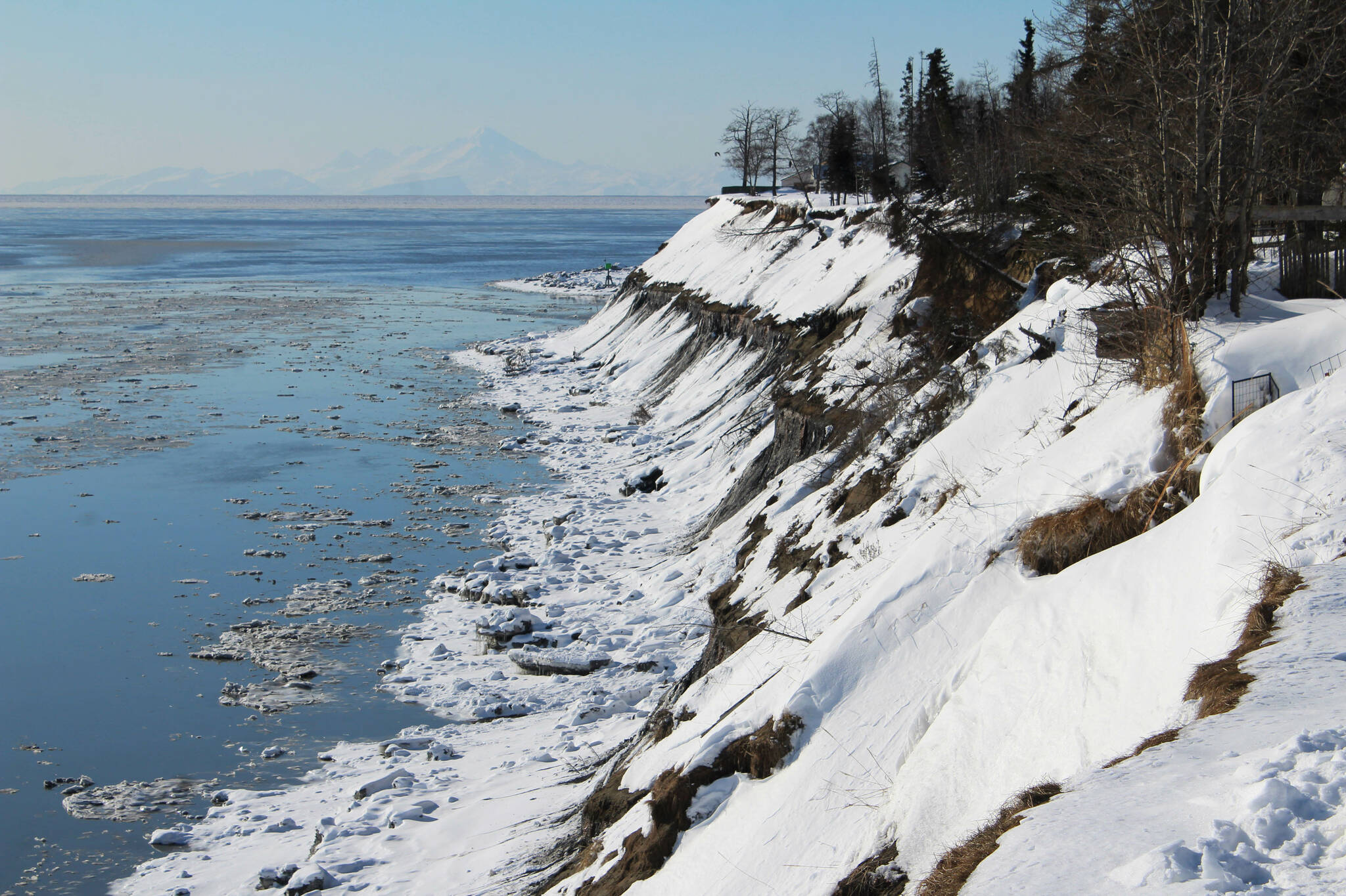 Snow coats an eroding bluff near the mouth of the Kenai River on Friday, March 3, 2023, in Kenai, Alaska. (Ashlyn O’Hara/Peninsula Clarion)