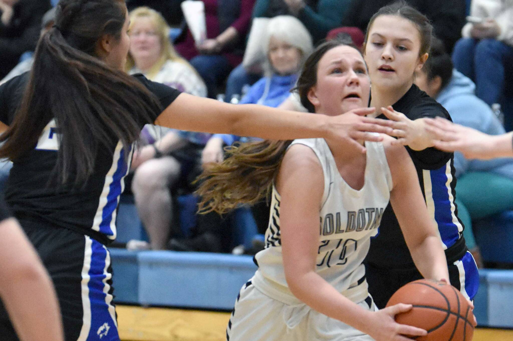 Soldotna's Josie Sheridan drives on Palmer's Ariana Belk on Saturday, March 4, 2023, at Soldotna High School in Soldotna, Alaska. (Photo by Jeff Helminiak/Peninsula Clarion)