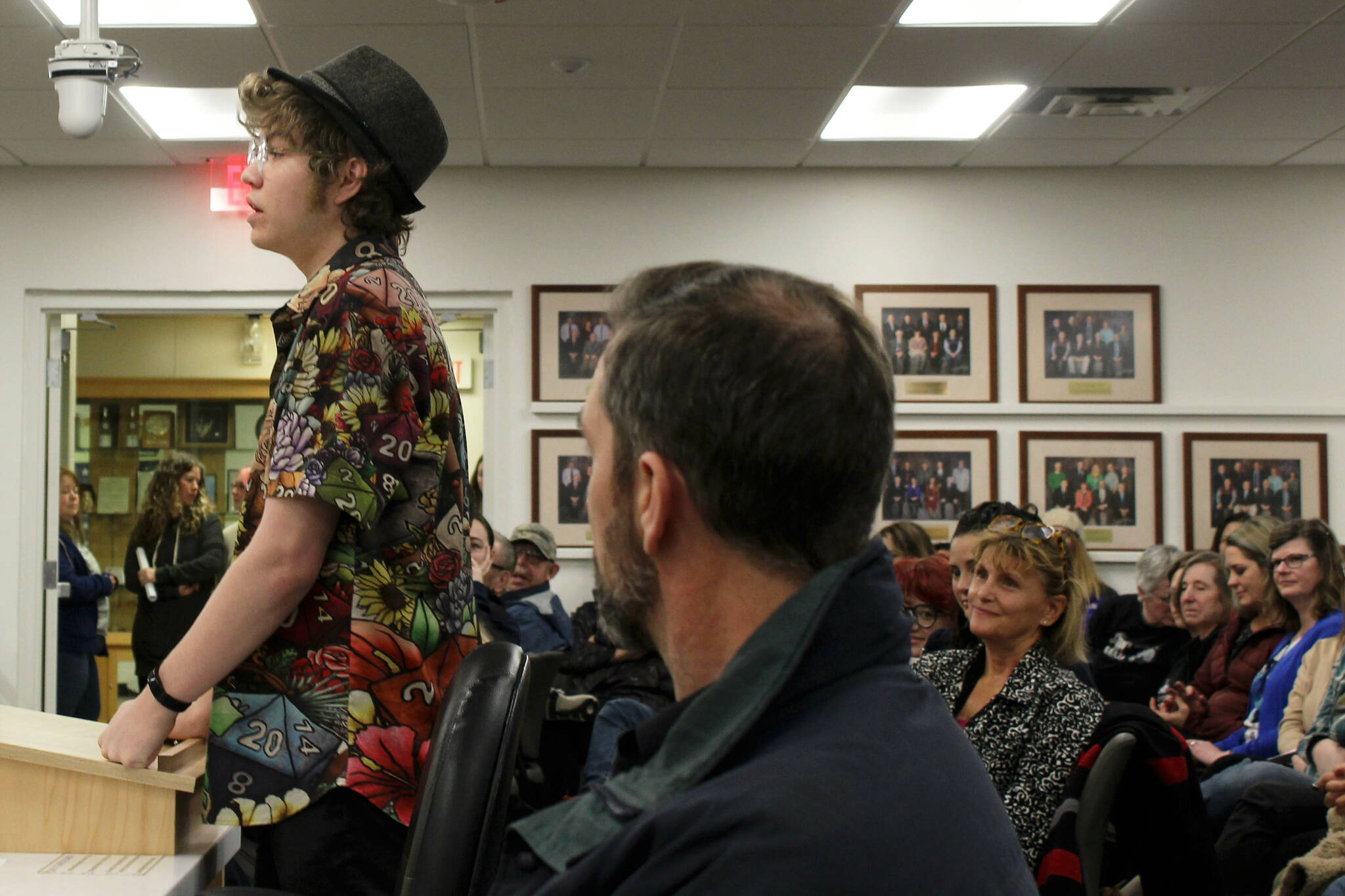 Soldotna High School senior Josiah Burton testifies in opposition to the proposed cut of Kenai Peninsula Borough School District theater technicians while audience members look on during a board of education meeting on Monday, March 6, 2023, in Soldotna, Alaska. (Ashlyn O’Hara/Peninsula Clarion)