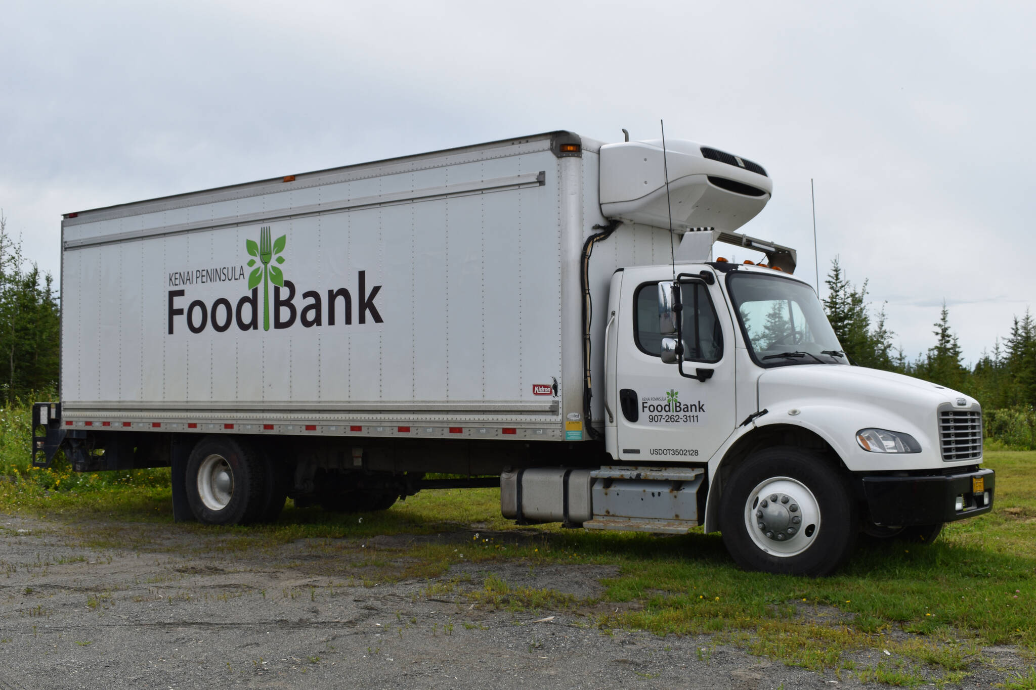 A Kenai Peninsula Food Bank truck in the Food Bank parking lot on Aug. 4, 2022 in Soldotna, Alaska (Jake Dye/Peninsula Clarion)