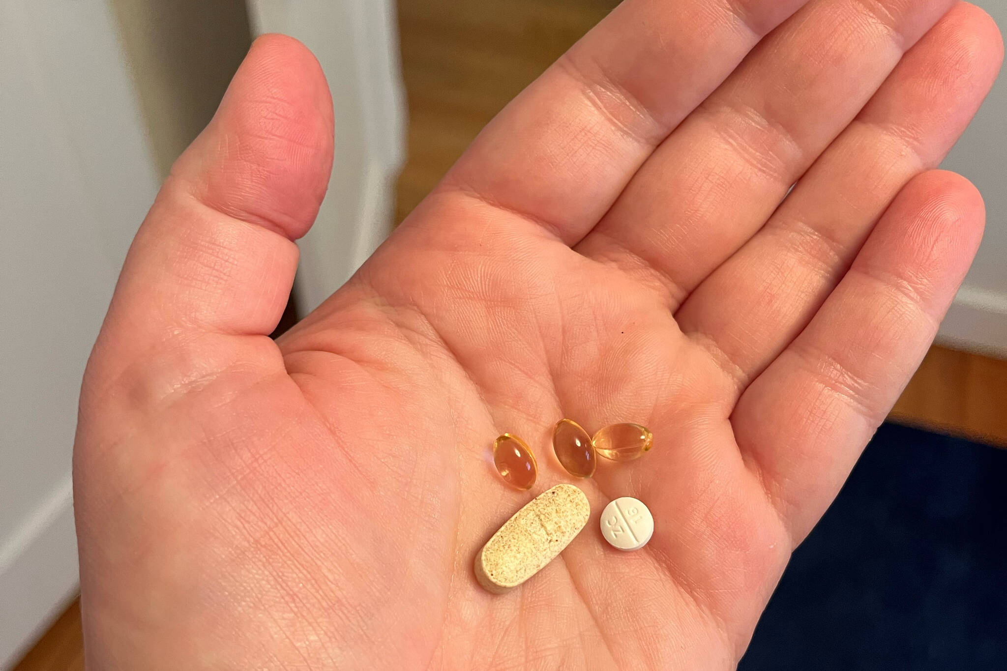 The author displays her daily vitamin, three yellowish clear bubbles of Vitamin D, and 20 mg of Paxil. (Photo by Meredith Harber/Minister’s Message)