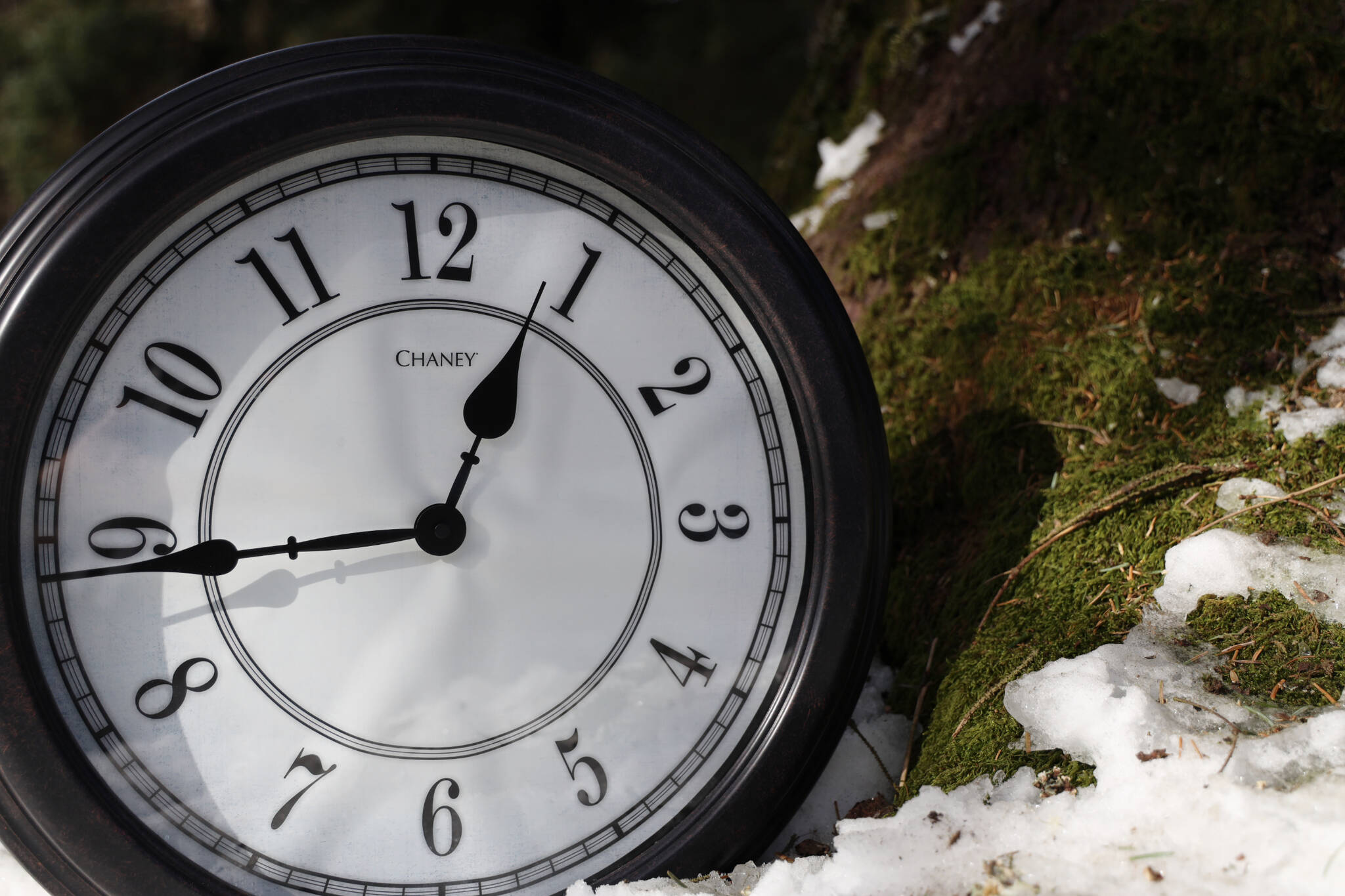 Clarise Larson / Juneau Empire File
The sun beams down on a clock and nearby melting snow. A bill that calls for Alaska to choose to remain in Daylight Saving Time for the entirety of the year and say farewell to the switch to Standard Time has been reintroduced to the Alaska Legislature this session.