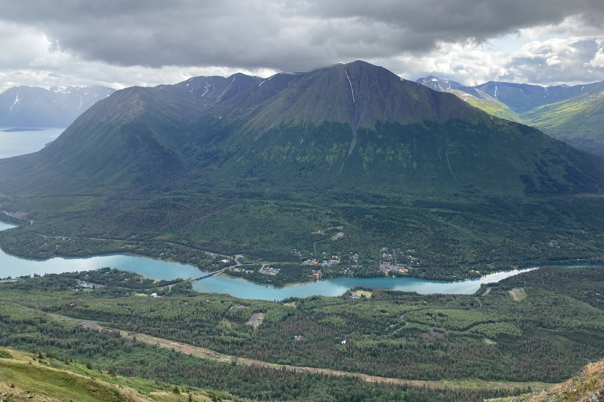 Areas cleared to make way for the Cooper Landing Bypass Project (bottom) can be seen above the Kenai River in Cooper Landing in this Aug. 10, 2021, photo. (Jeff Helminiak/Peninsula Clarion file)