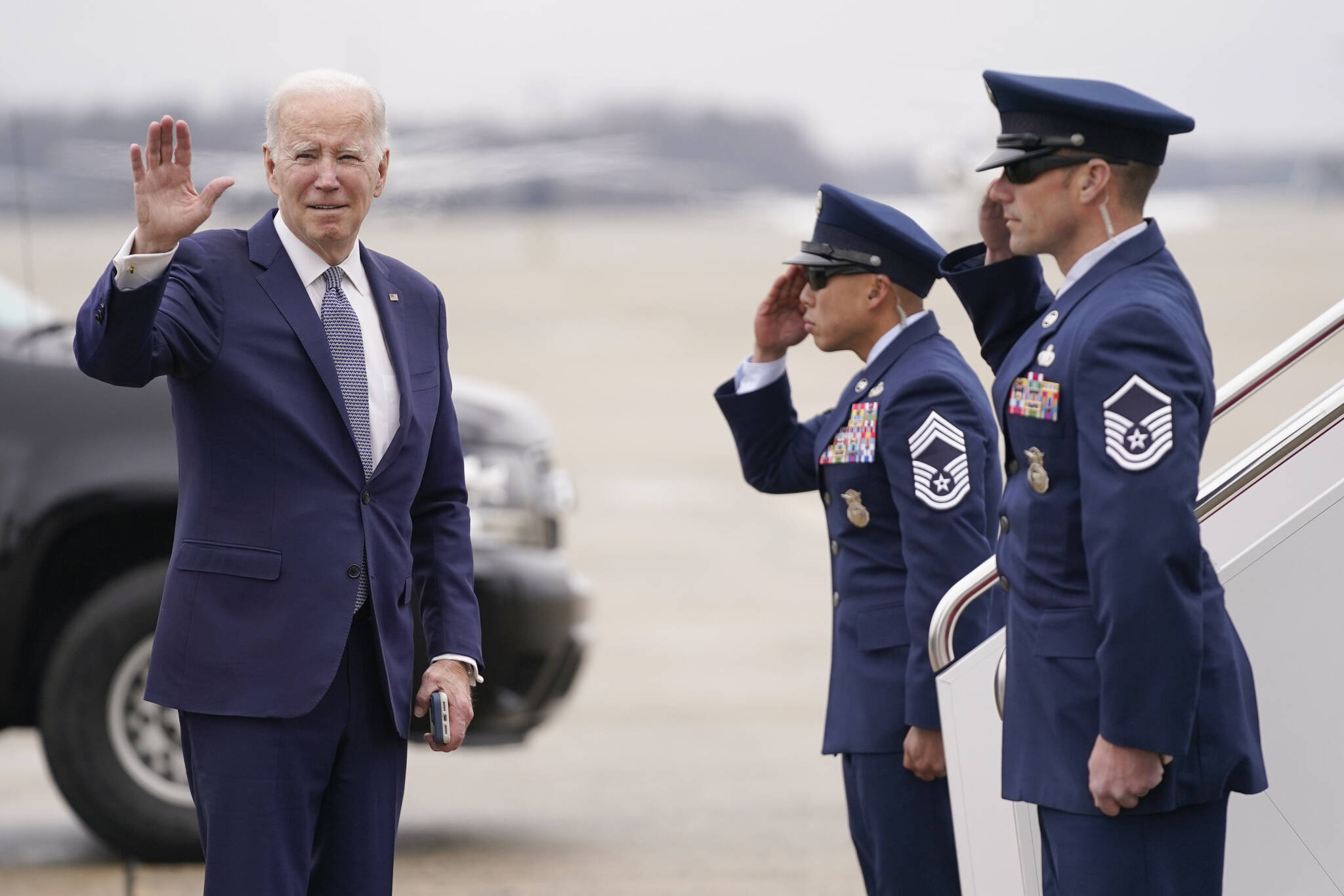 President Joe Biden waves before boarding Air Force One for a trip to San Diego to meet with British Prime Minister Rishi Sunak and Australian Prime Minister Anthony Albanese, Monday, March 13, 2023, in Andrews Air Force Base, Md. (AP Photo/Evan Vucci)