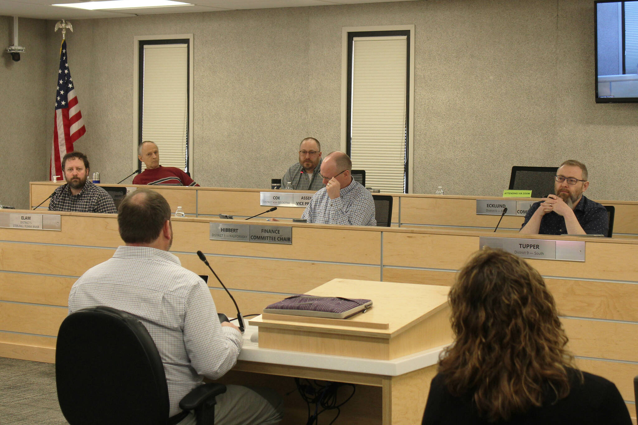 Foreground: Kenai Peninsula Borough School District Superintendent Clayton Holland, left, and KPBSD Finance Director Liz Hayes, right, speak about the district’s fiscal year 2024 budget during a work session with the Kenai Peninsula Borough Assembly on Tuesday, March 14, 2023, in Soldotna, Alaska. (Ashlyn O’Hara/Peninsula Clarion)