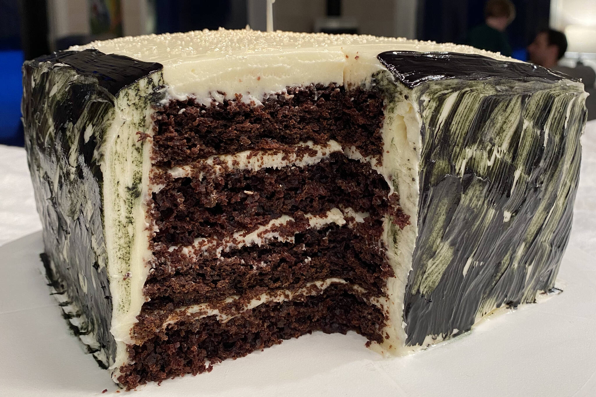 Chocolate cake is topped with white chocolate cream cheese frosting. (Photo by Tressa Dale/Peninsula Clarion)