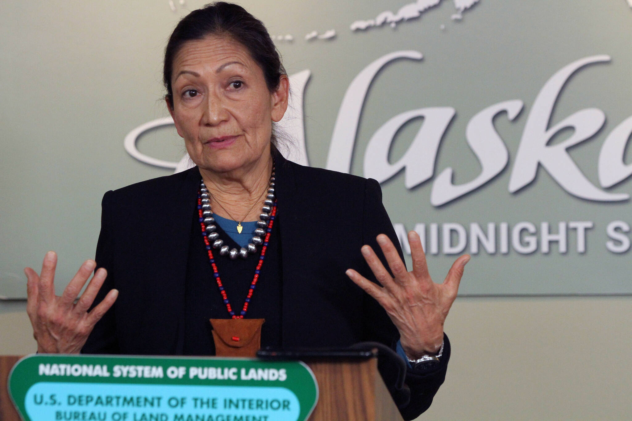 Interior Secretary Deb Haaland gestures while addressing reporters during a news conference, April 21, 2022, in Anchorage, Alaska. Haaland on Tuesday, March 14, 2023, withdrew a 2019 exchange agreement finalized during the Trump administration that has been the subject of ongoing litigation, citing a lack of public participation and environmental review. (AP Photo/Mark Thiessen, File)