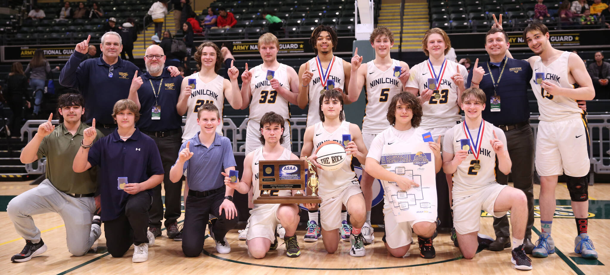 The Ninilchik boys basketball team celebrates their second straight Class 2A state championship Saturday, March 18, 2023, at the Alaska Airlines Center in Anchorage, Alaska. (Photo courtesy of Robin Moore)