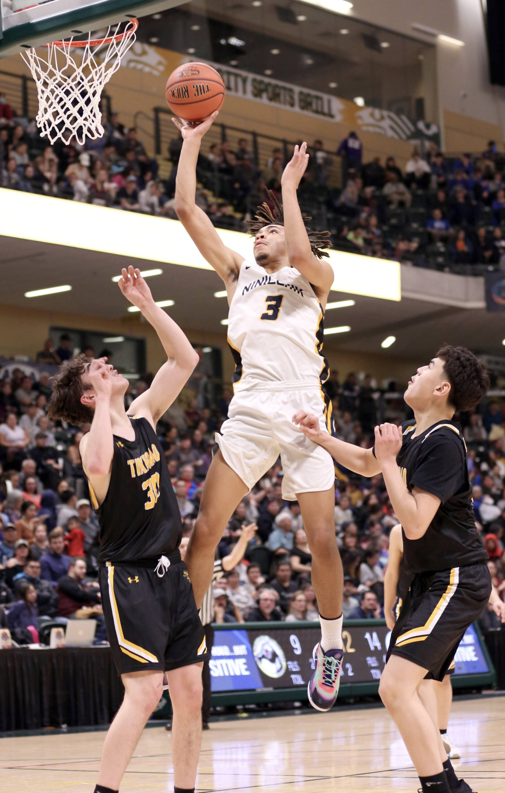 Ninilchik’s Jaylin Scott soars to the basket against Tikigaq during the Class 2A boys state championship Saturday, March 18, 2023, at the Alaska Airlines Center in Anchorage, Alaska. (Photo courtesy of Robin Moore)